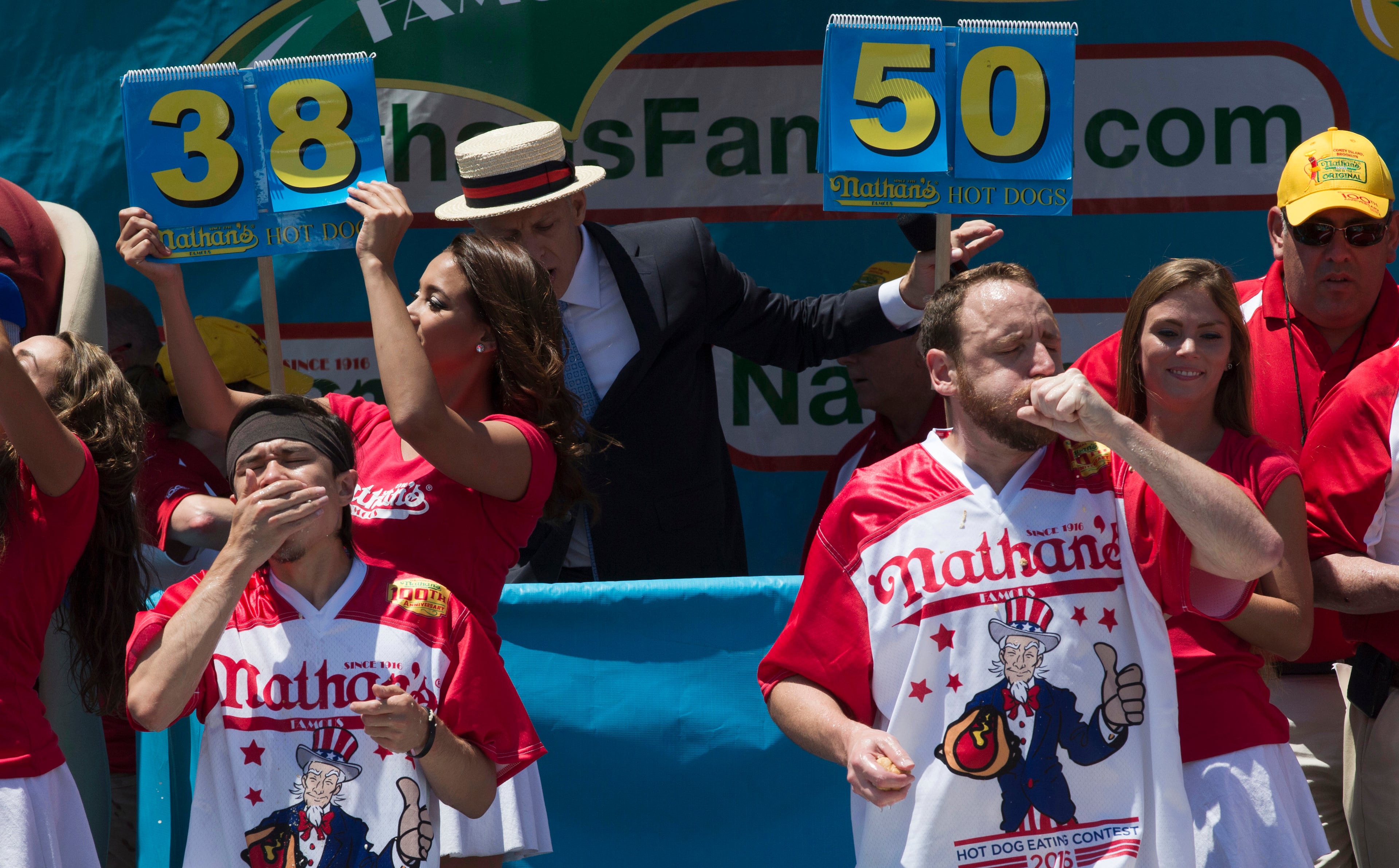 Matt Stonie, left, and Joey Chestnut compete in Nathan's Famous Fourth of July International Hot Dog Eating Contest men's competition, Monday, July 4, 2016, in New York. Chestnut came in first eating 70 hot dogs and buns in 10 minutes. Stonie came in second eating 53 hot dogs and buns in 10 minutes. (AP Photo/Mary Altaffer)