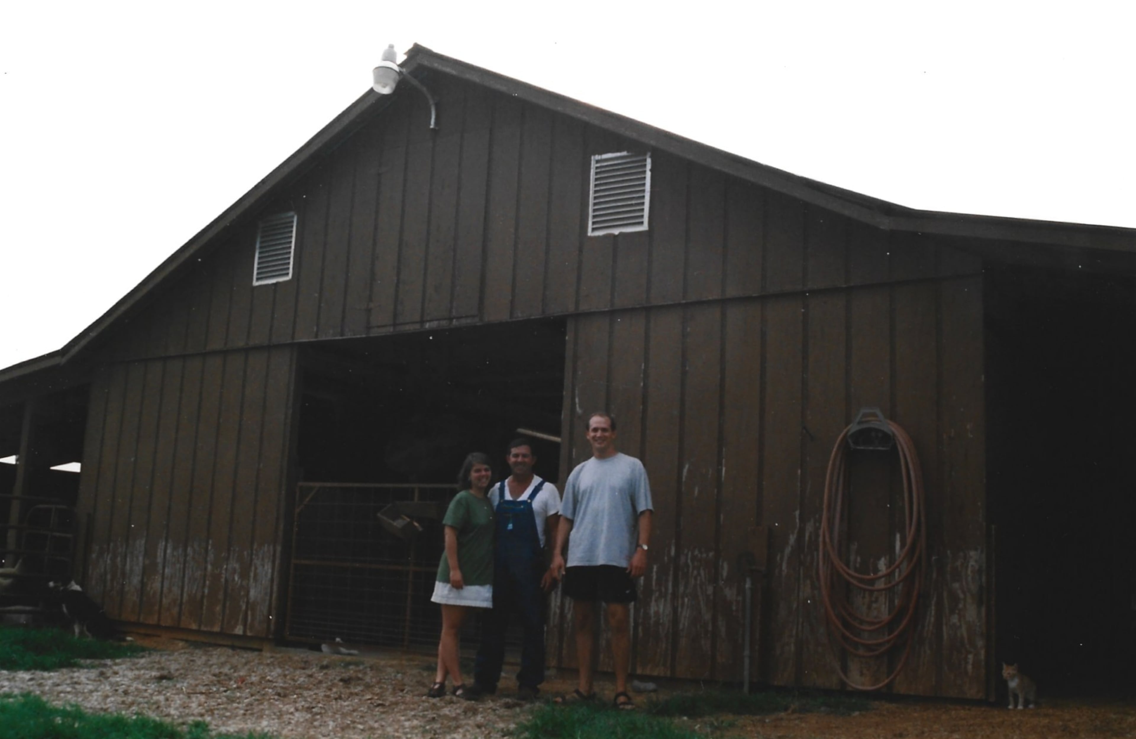 Heather and Steve pose with Heather's father, Patrick Hardy, at Clover Leaf Farm. Steve visited the farm the day after meeting Heather at the 1996 Summer Olympics. (Courtesy of Steve Leo)