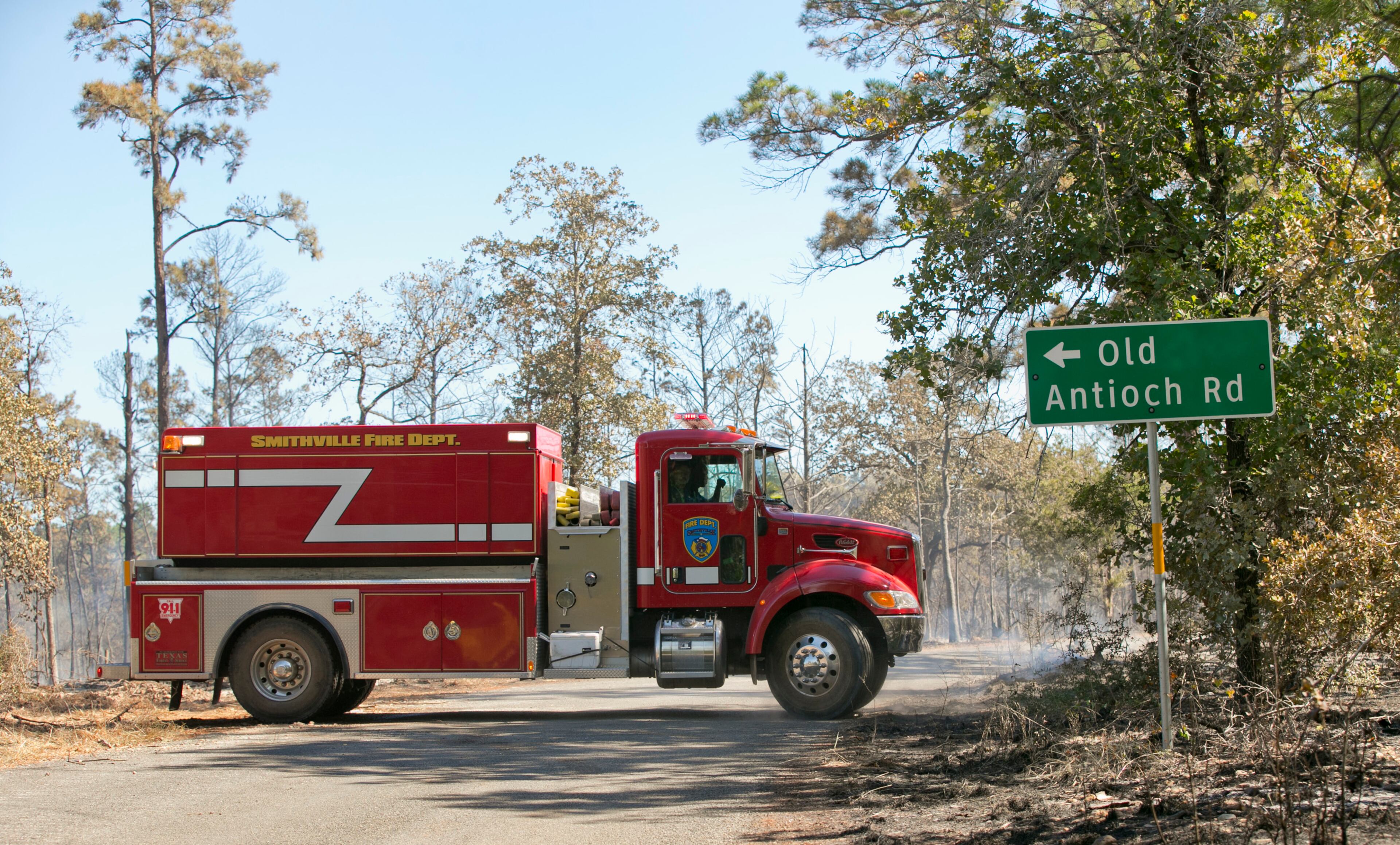 Smithville firefighters work in Buescher State Park during the Hidden Pines Fire on Thursday October 15, 2015. JAY JANNER / AMERICAN-STATESMAN
