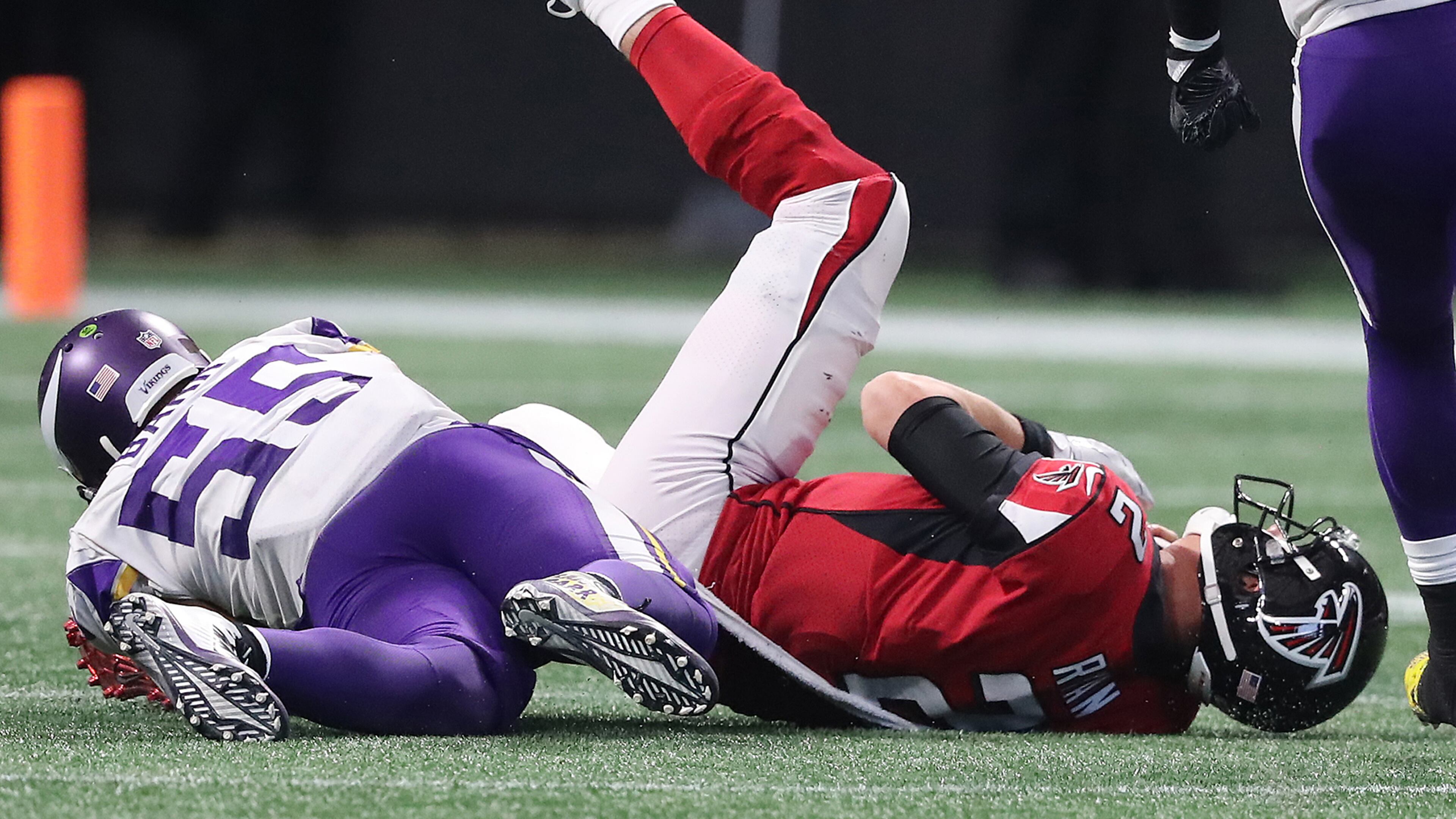 Falcons quarterback Matt Ryan is tackled by Minnesota linebacker Anthony Barr in the second half Sunday. The Falcons lost 14-9.