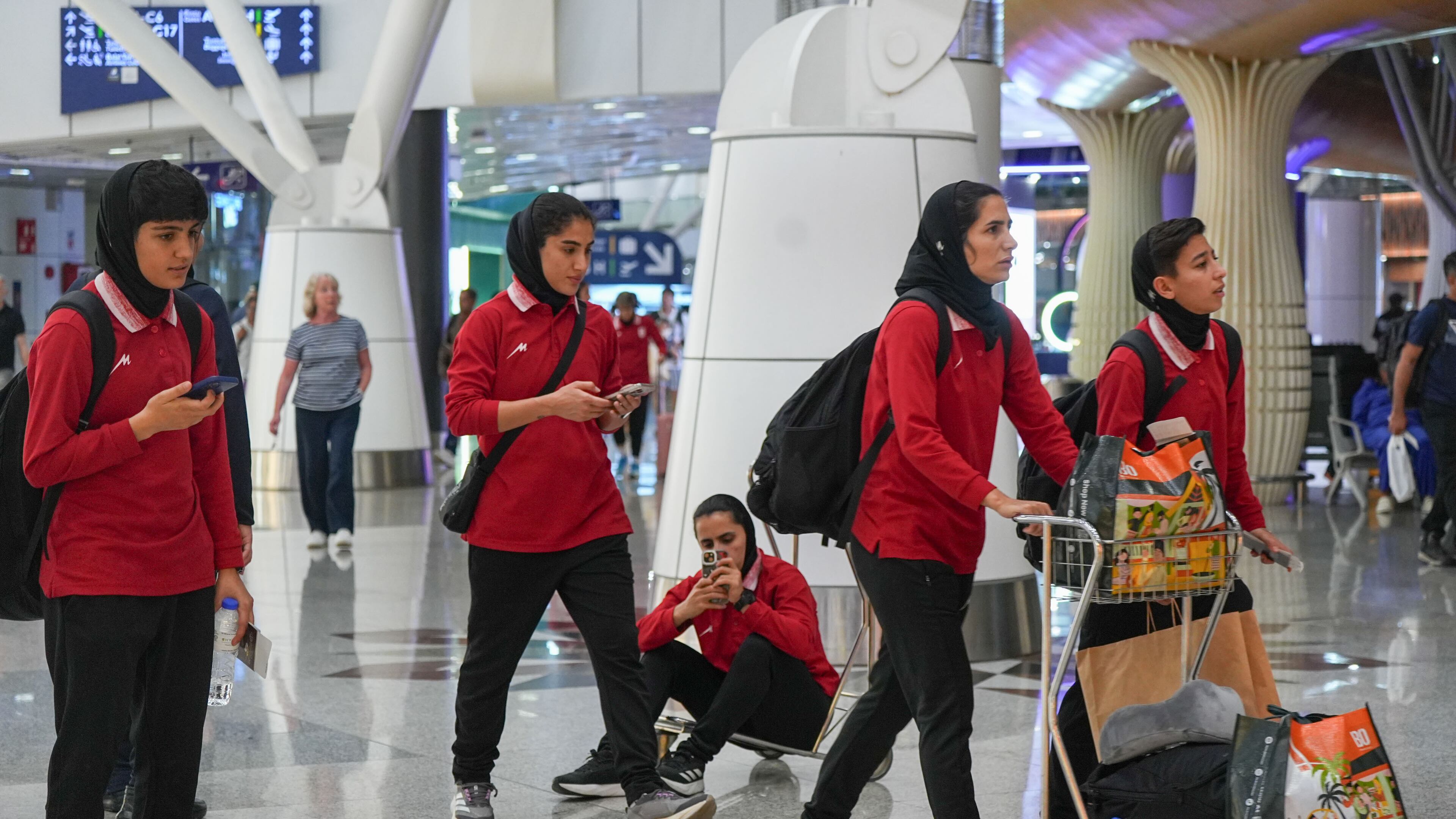 Members of Iran's women's football team arrive at the Kuala Lumpur International Airport in Sepang, Malaysia, Monday, March 16, 2026. (AP Photo/Azneal Ishak)