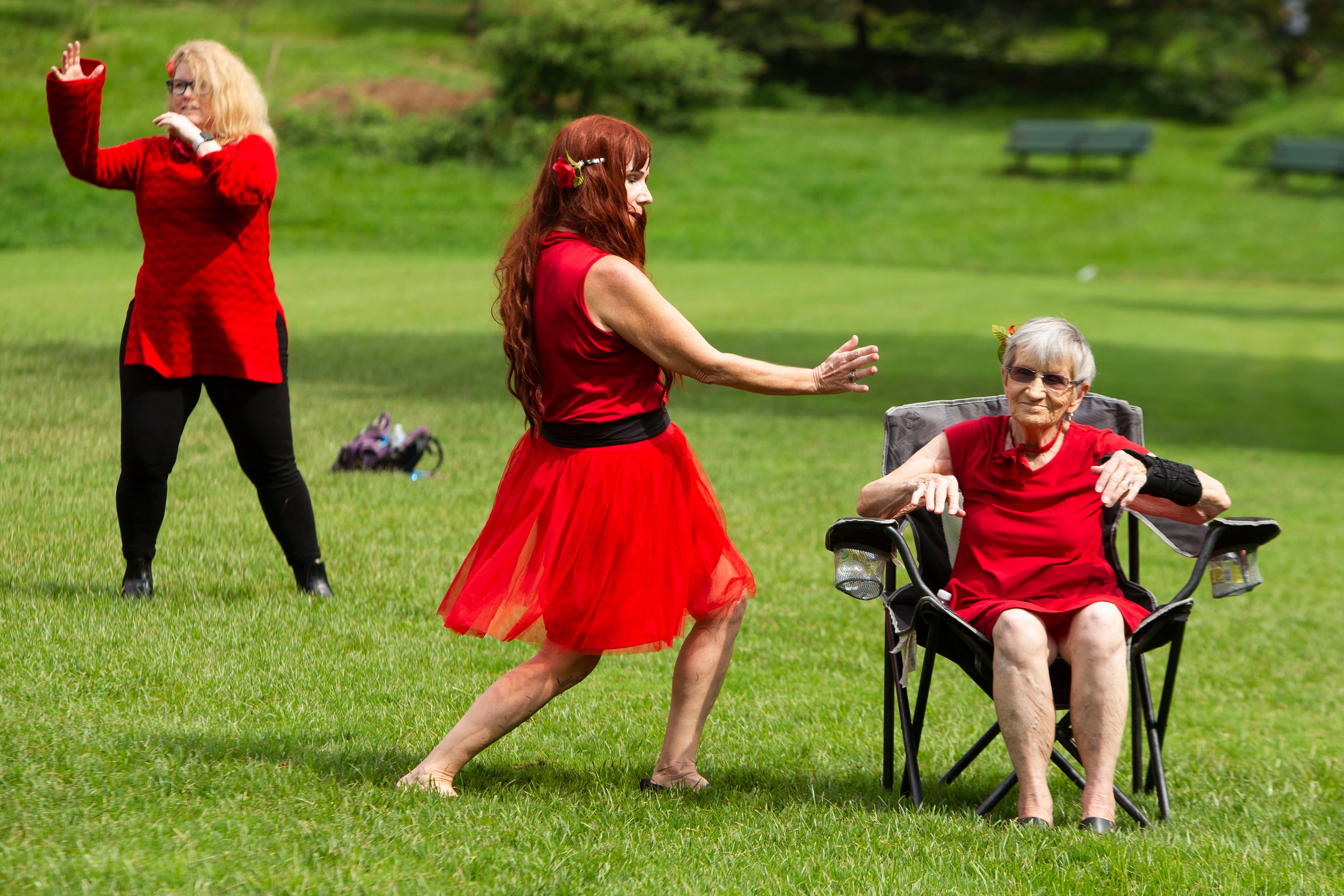 Eileen Sexton (right) and daughter Christine Sexton (center) dance during a group dance to celebrate the seventh annual international "Most Wuthering Heights Day Ever," on Saturday, July 30, 2022, in Candler Park in Atlanta. The event celebrates Kate Bush's 1978 song "Wuthering Heights" with events in more than 40 cities around the world. CHRISTINA MATACOTTA FOR THE ATLANTA JOURNAL-CONSTITUTION