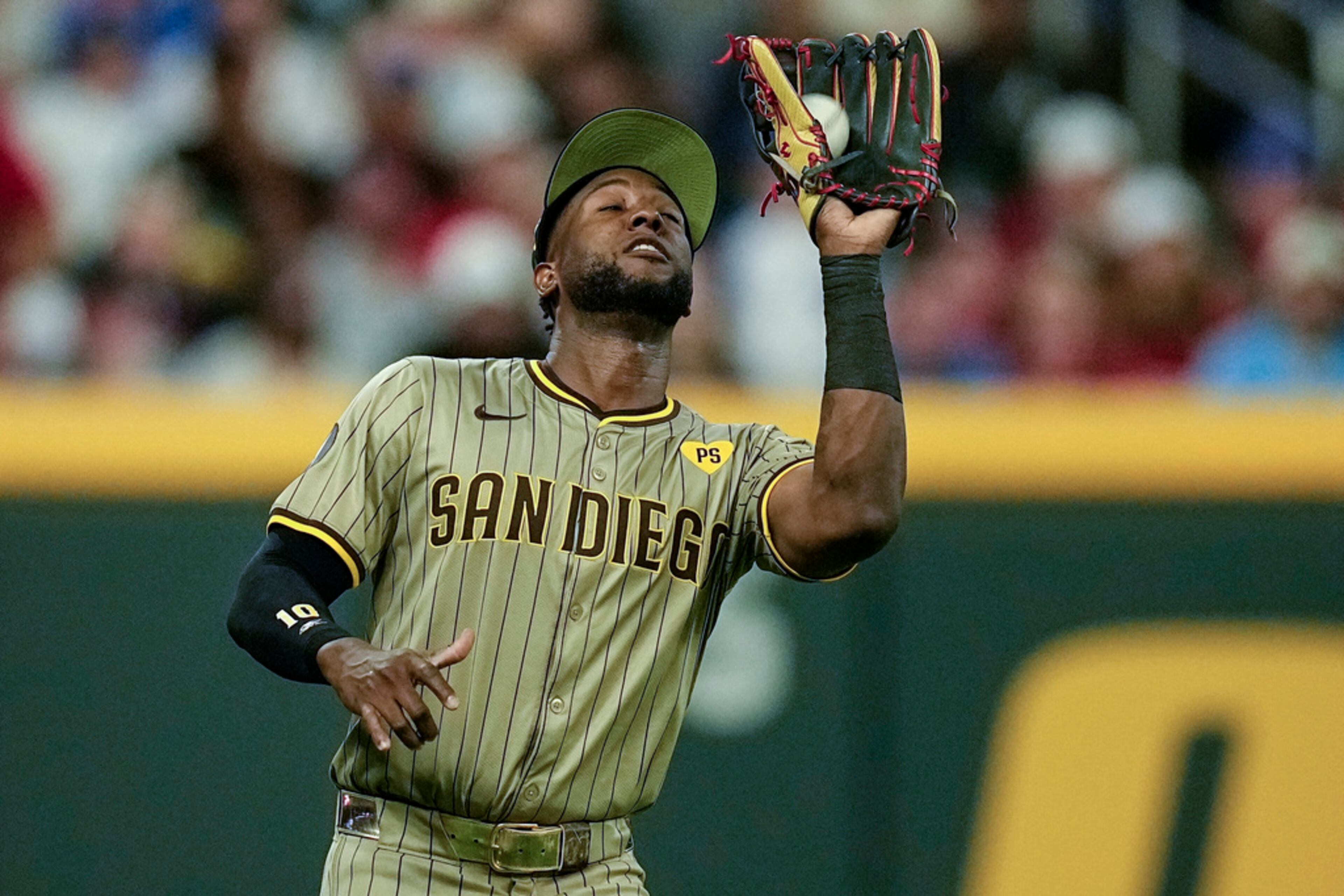 San Diego Padres outfielder Jurickson Profar (10) makes the catch off the bat of Atlanta Braves' Ozzie Albies (1) in the fifth inning of a baseball game, Friday, May 17, 2024, in Atlanta. (AP Photo/Mike Stewart)