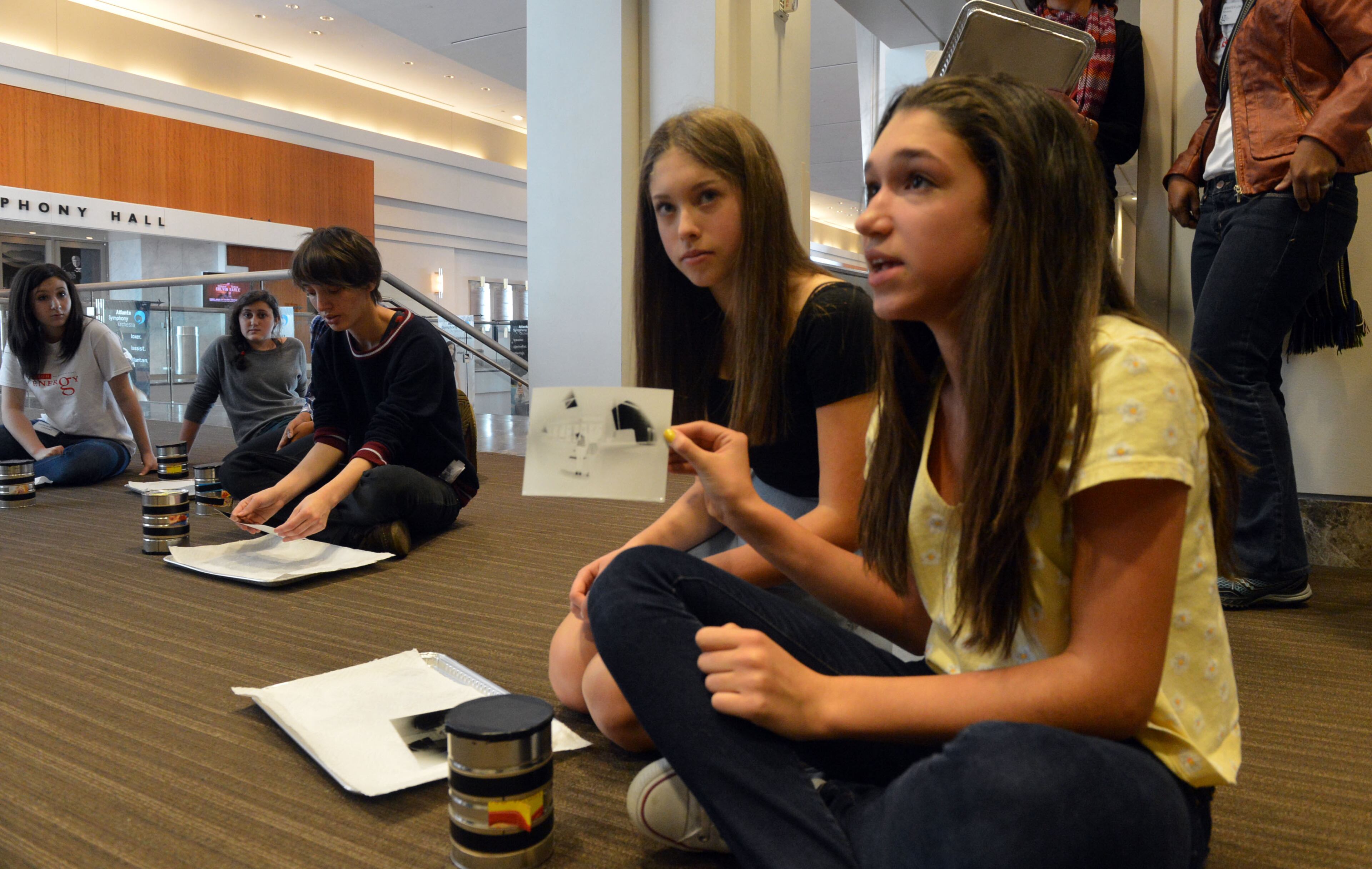 Seventh grade students Addie Trivers (left) and Terry Berger, both 13, discuss making images with pinhole cameras during their school session at the High Monday, February 24, 2014. The High Museum has partnered with the Galloway School to offer their students a day of school with "no walls." The museum was closed completely Monday to allow these students - ages 3-18- the opportunity to learn all of their core subjects (math, reading, science, etc) through the different art exhibitions at the Museum. They interacted with the current art exhibitions at the High to learn their subjects. This is the first time the Museum has allowed an entire school to come in and learn for the day. Galloway is the first school in Atlanta (and the state of GA) to experience school with no walls.
