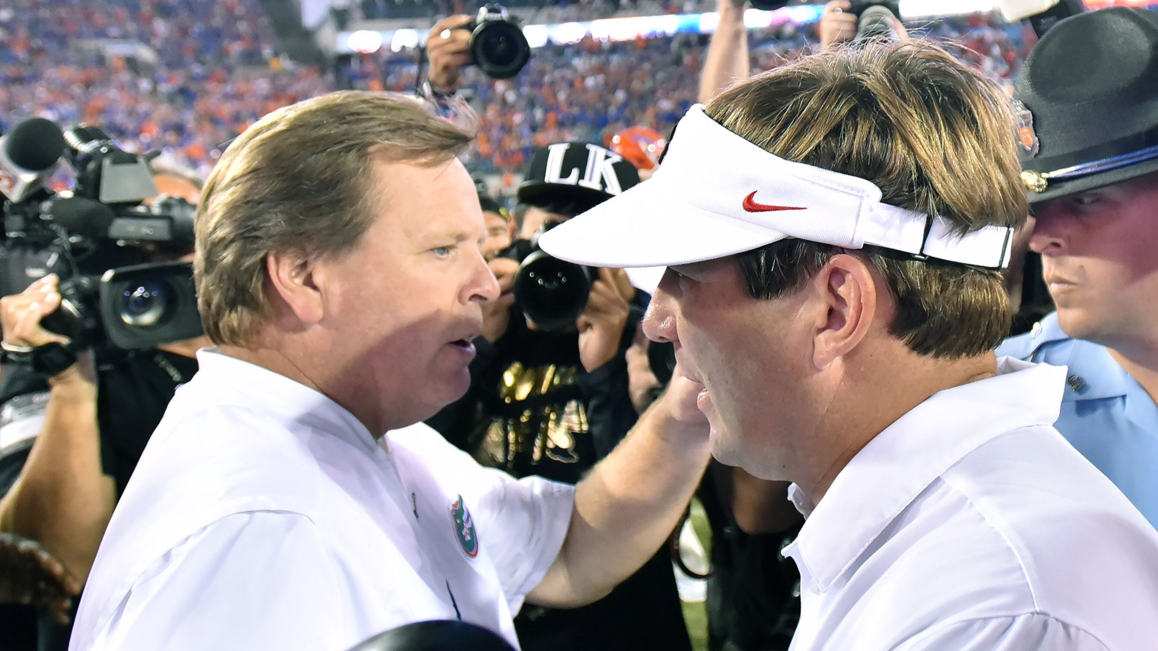 Georgia coach Kirby Smart and Florida coach Jim McElwain meet after last year’s game in Jacksonville.