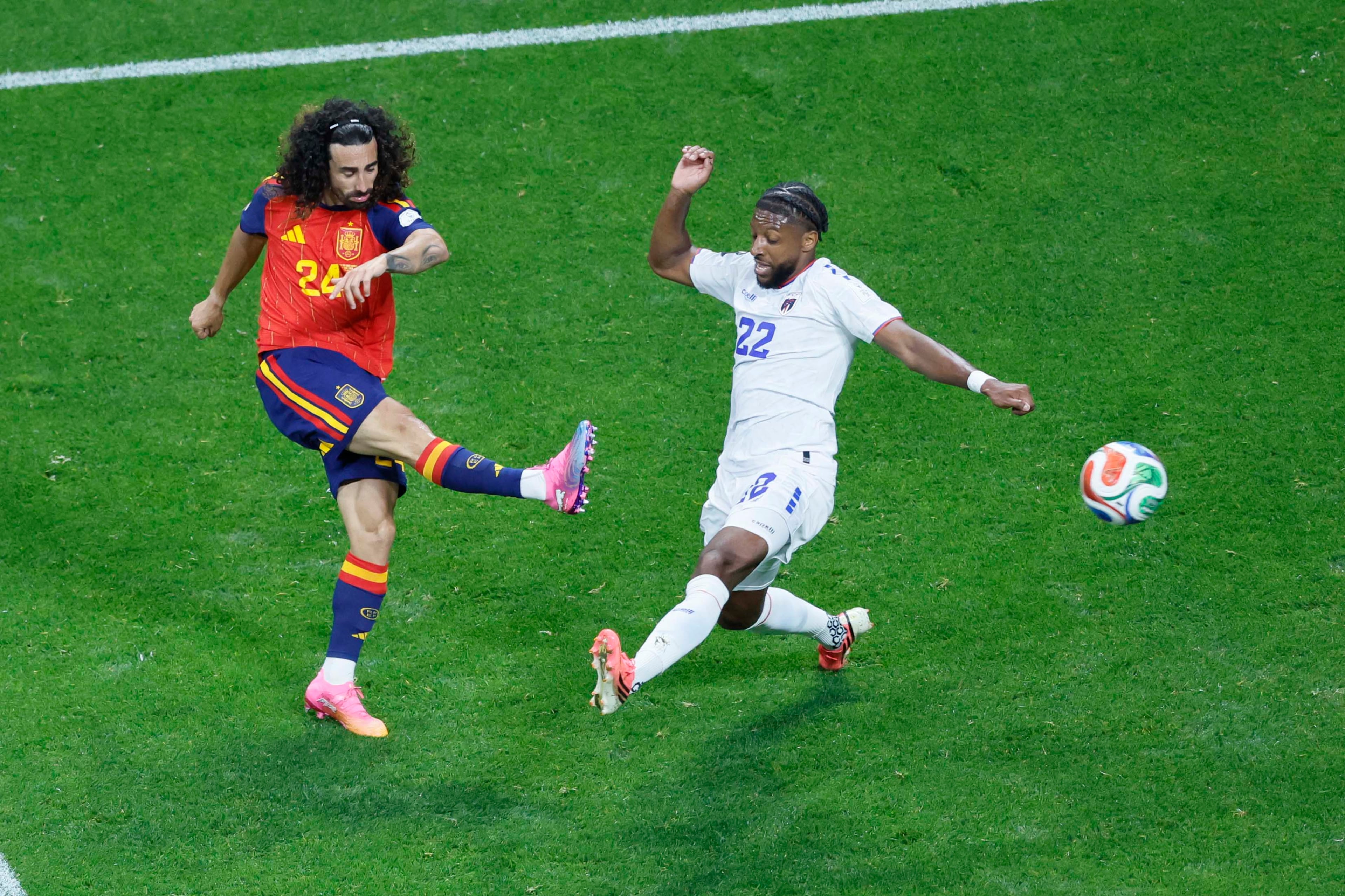 Spain defender Marc Cucurella (left) shoots the ball under pressure from Cape Verde defender Steven Moreira (right) during a World Cup Group H soccer match at Atlanta Stadium (Mercedes-Benz Stadium) on Monday, June 15, 2026. (Miguel Martinez/AJC)