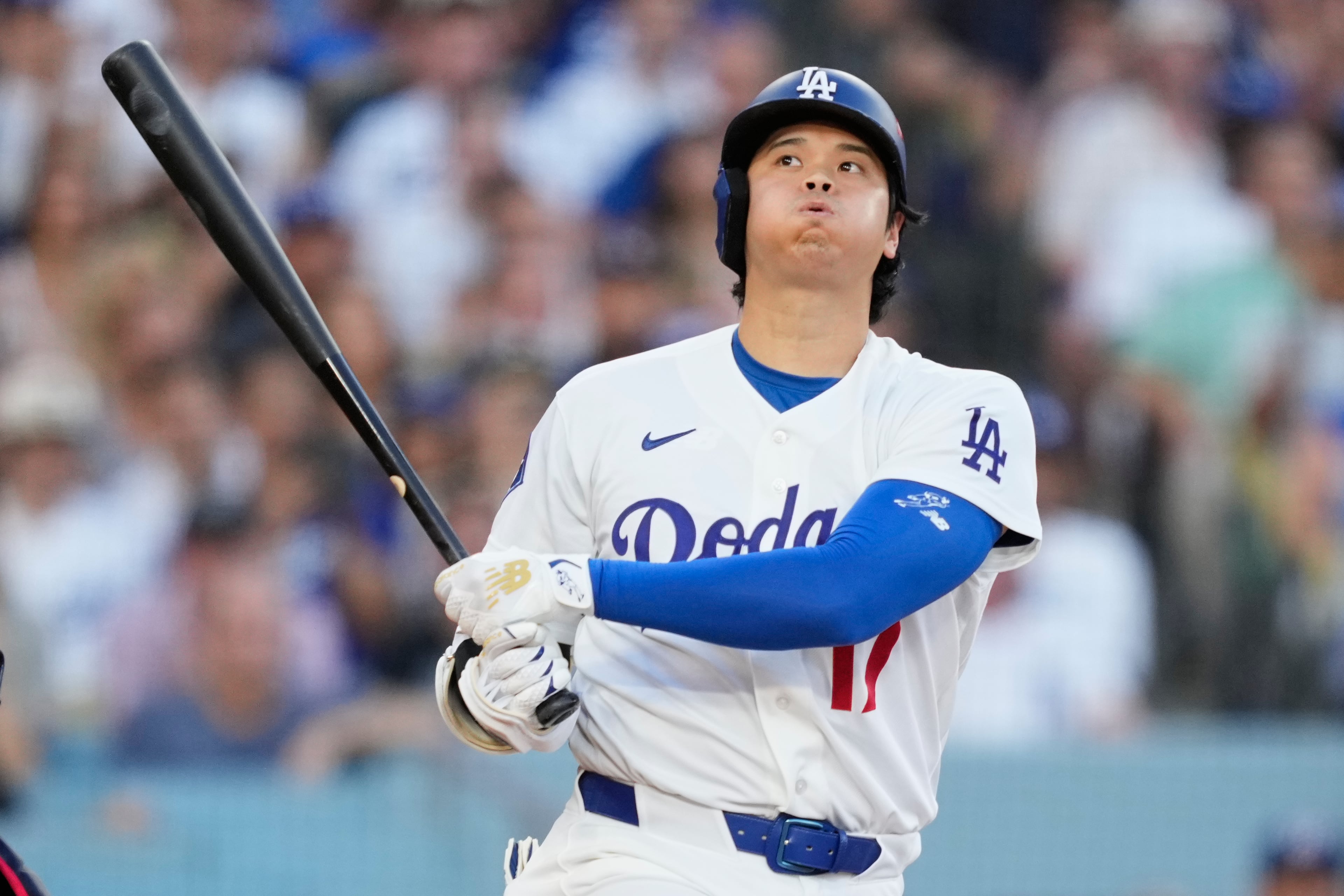 Los Angeles Dodgers' Shohei Ohtani exhales while batting during the third inning of Game 2 of a National League Division Series baseball game against the Atlanta Braves Sunday, Oct. 4, 2026, in Los Angeles. (AP Photo/Mark J. Terrill)