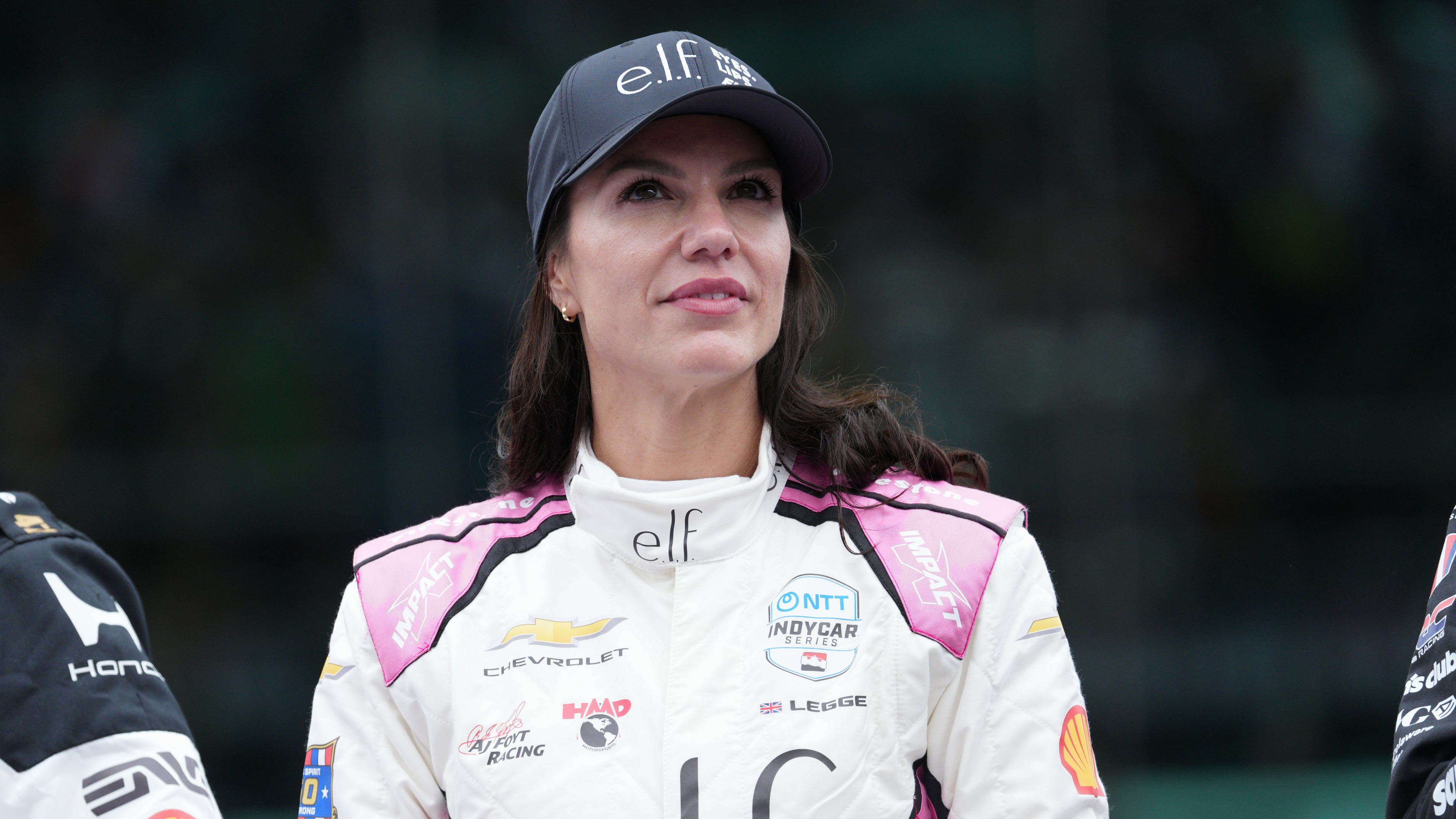 Katherine Legge, of Great Britain, looks at the crowd during driver introductions before the start of the Indianapolis 500 auto race at the Indianapolis Motor Speedway, Sunday, May 24, 2026 in Indianapolis. (AP Photo/AJ Mast)