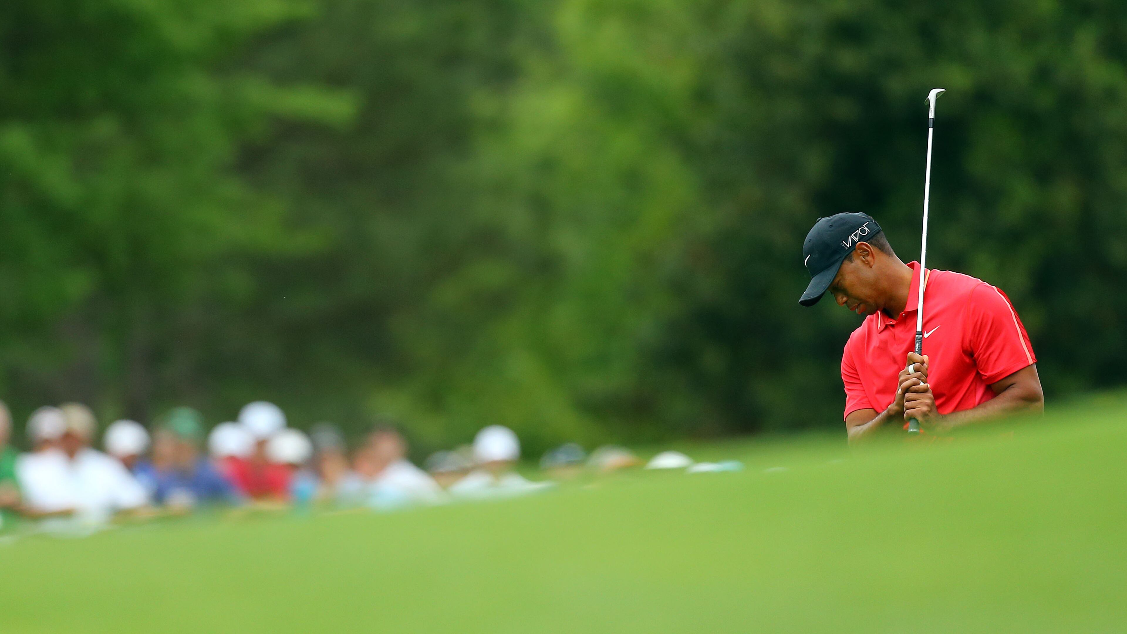 Tiger Woods reacts to his chip at No. 8 during his final round of the 2015 Masters, the last in which he has appeared. (Curtis Compton/ccompton@ajc.com)