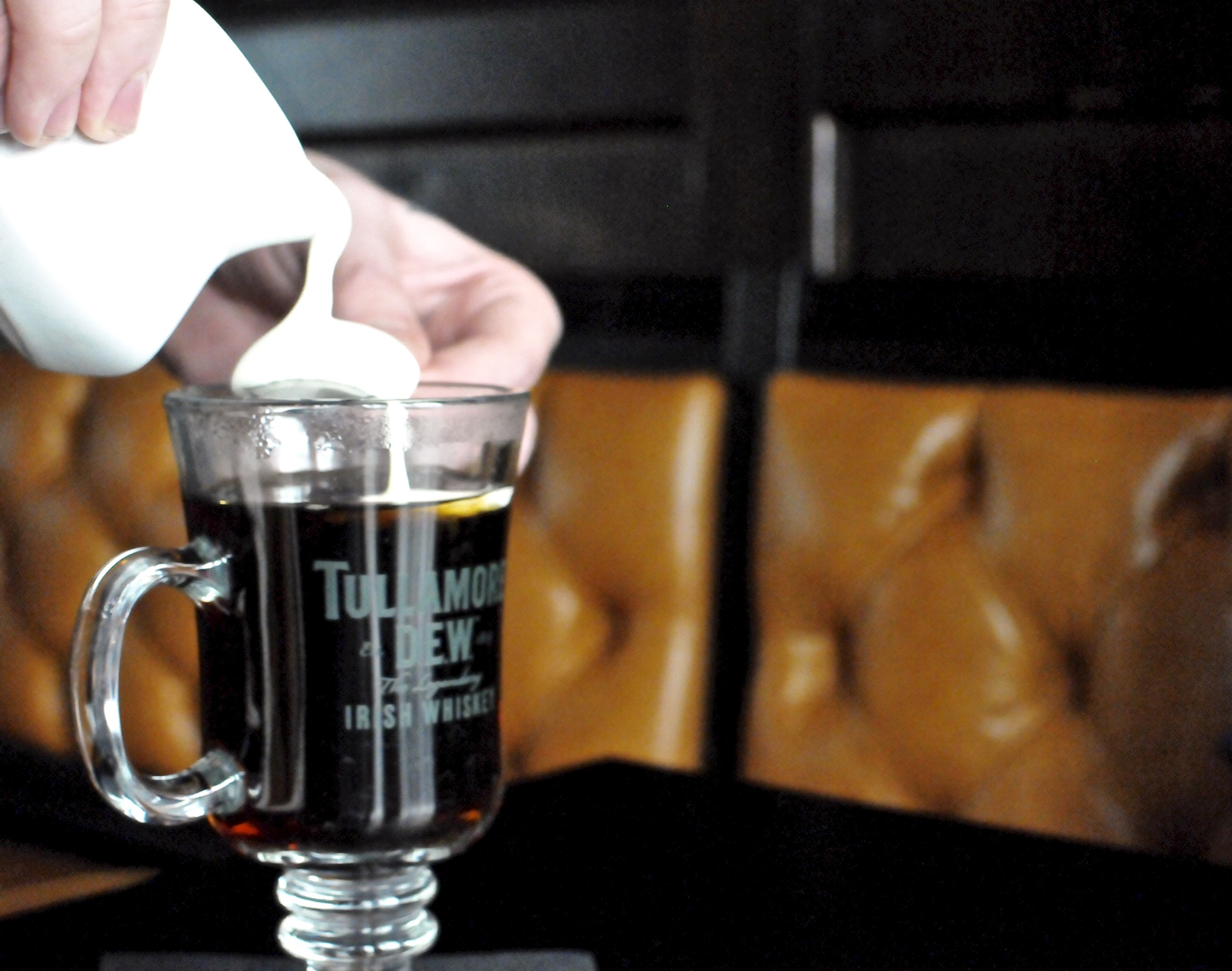 Fado's Jameson Irish whiskey toddy is topped tableside with a thick layer of whipped cream. Courtesy of John Piccirillo
