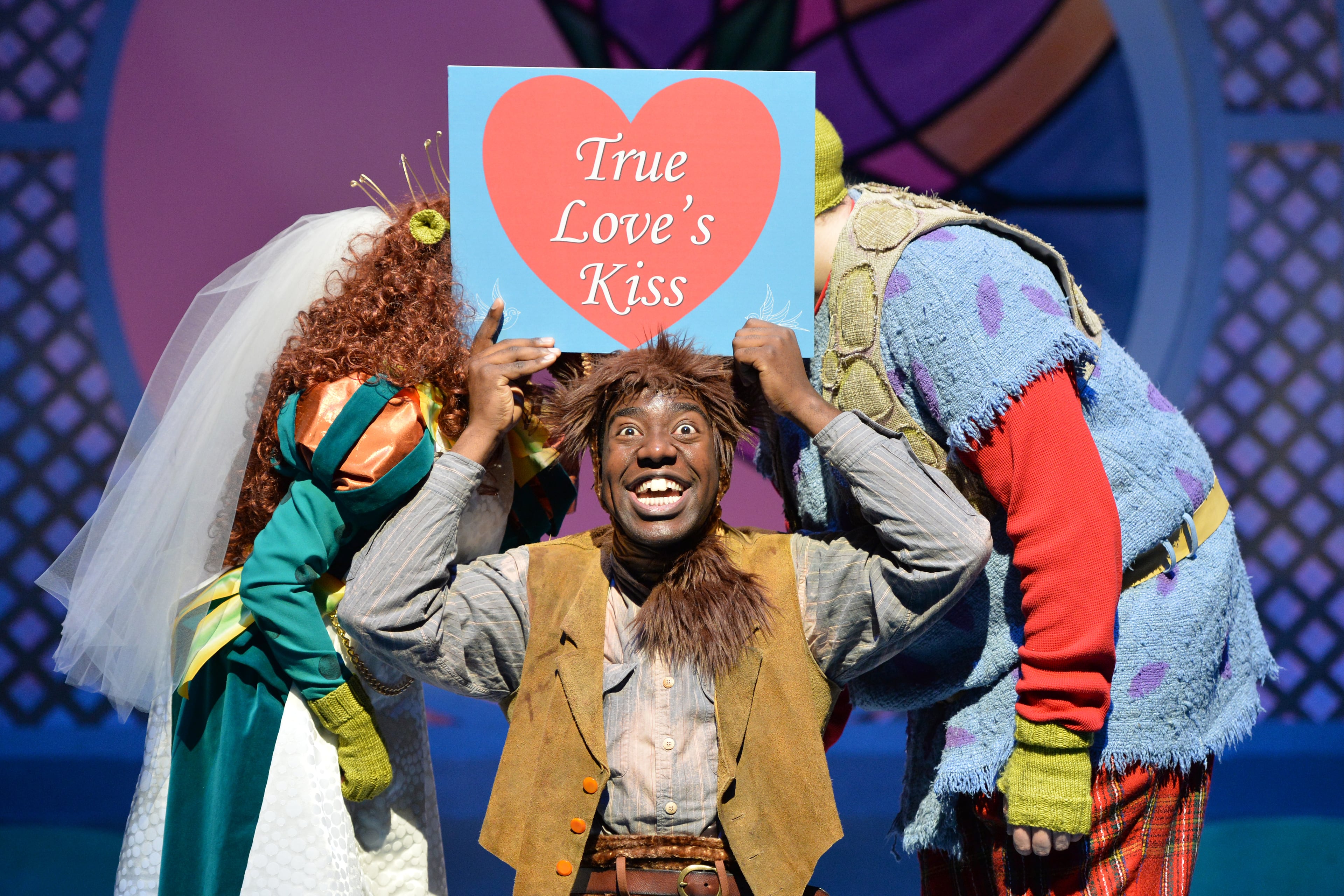 Monte J. Howell (Donkey) performs with Galen Crawley (Fiona) and Caleb Clark (Shrek) during their rehearsal of "Shrek the Musical" at Alliance Theatre on Tuesday, Feb. 18, 2014. Preview of the new production of "Shrek the Musical" at Alliance Theatre. Alliance Theatre presents Shrek the Musical, based on the beloved Dreamworks film character and William Steig� 1990s book, Feb. 22 through March 16, 2014 as part of its Alliance Stage Family Series. Rosemary Newcott, the Sally G. Tomlinson Artistic Director of Theatre for Youth and Families, directs this enchanting production, which ran for 12 months on Broadway and is now adapted to a family-friendly one-act experience. HYOSUB SHIN / HSHIN@AJC.COM