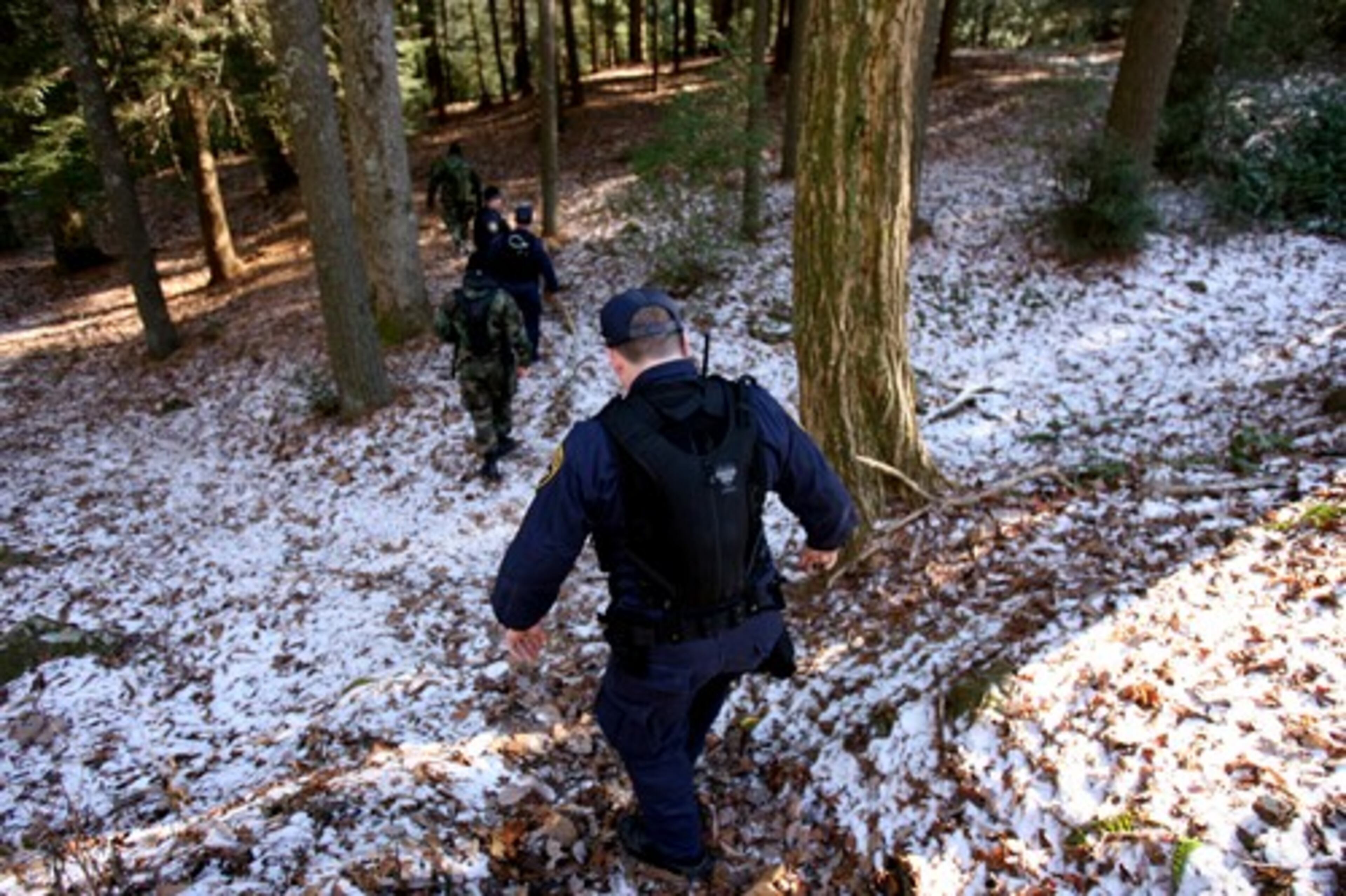 Members of the Gwinnett County Sheriff's Rapid Response Team aid in the search Friday on Blood Mountain at Vogel State Park.