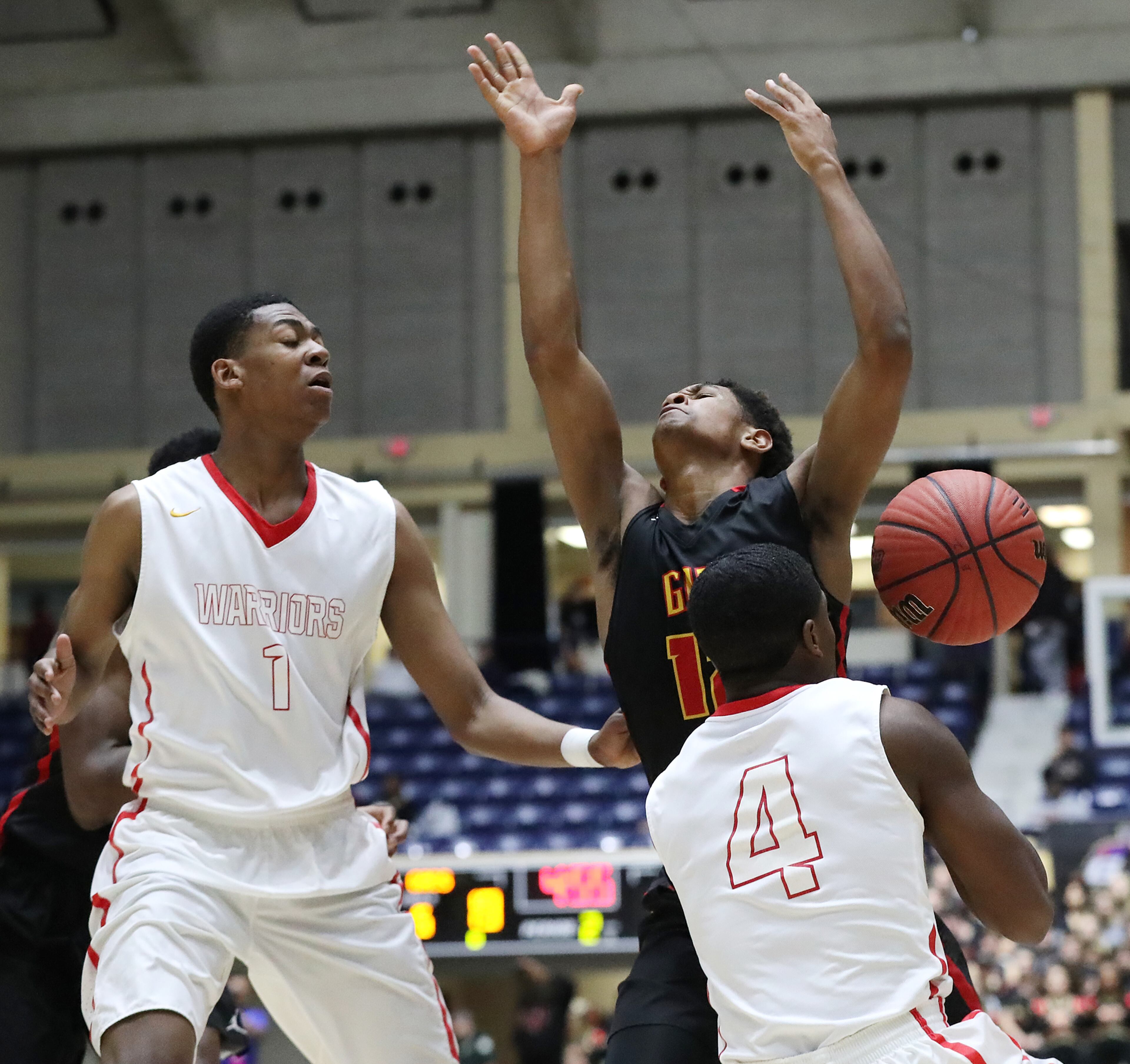 March 8, 2018 Macon: GAC guard Hunter McIntosh turns it over to Jenkins defenders Lamont Sams Jr. and Ahmad OâNeal in their GHSA state basketball championship game on Thursday, March 8, 2018, in Macon. Curtis Compton/ccompton@ajc.com