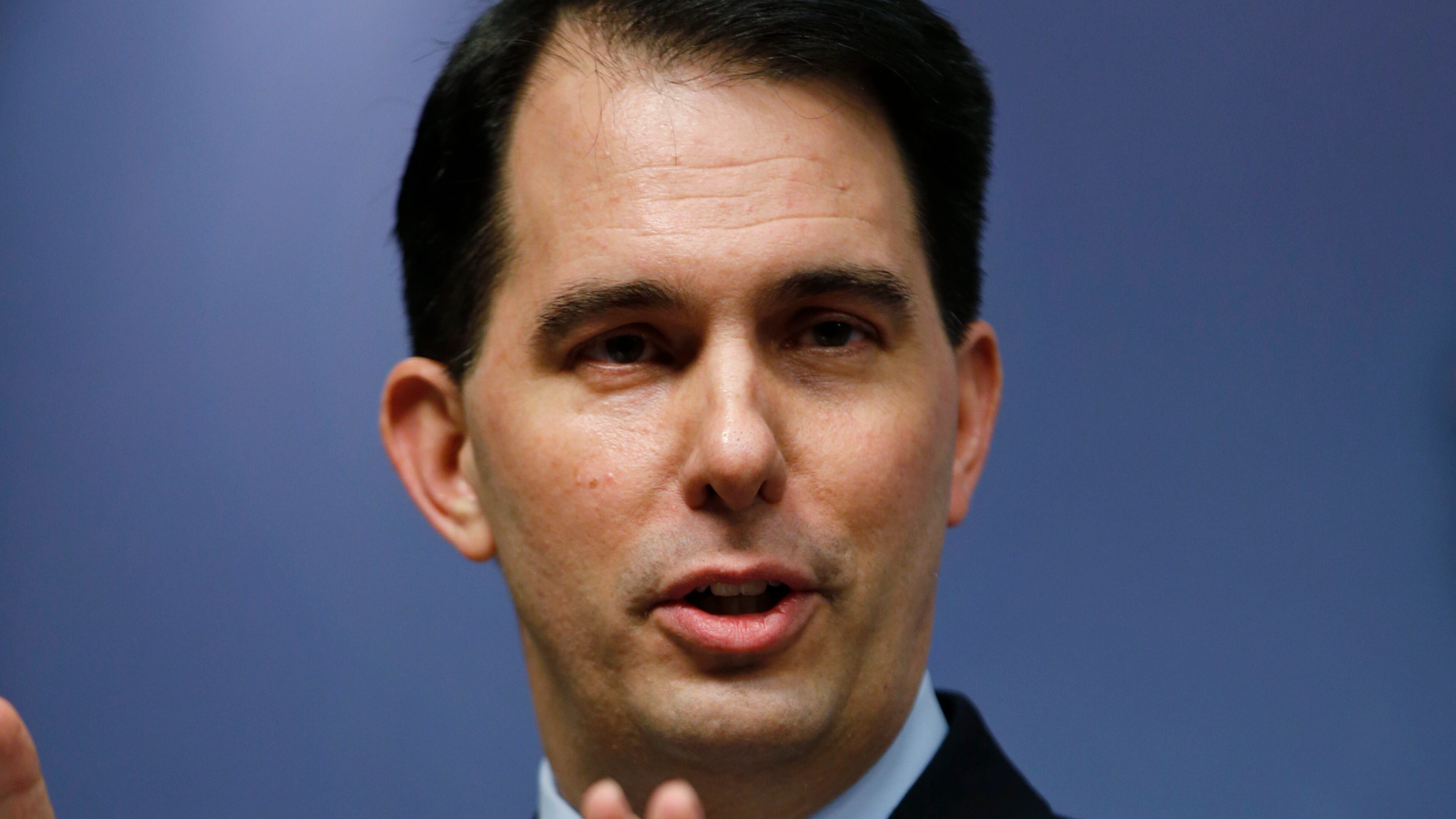 Wisconsin Gov. Scott Walker delivers his speech at Chatham House in central London, Wednesday, Feb. 11, 2015. Walker is leading a coalition of Wisconsin government and business officials on a trade mission in the UK that runs until Friday, Feb. 13, 2015. The trip gives him a chance to bolster his overseas and foreign policy credentials as he considers running for US President in 2016. (AP Photo/Lefteris Pitarakis)