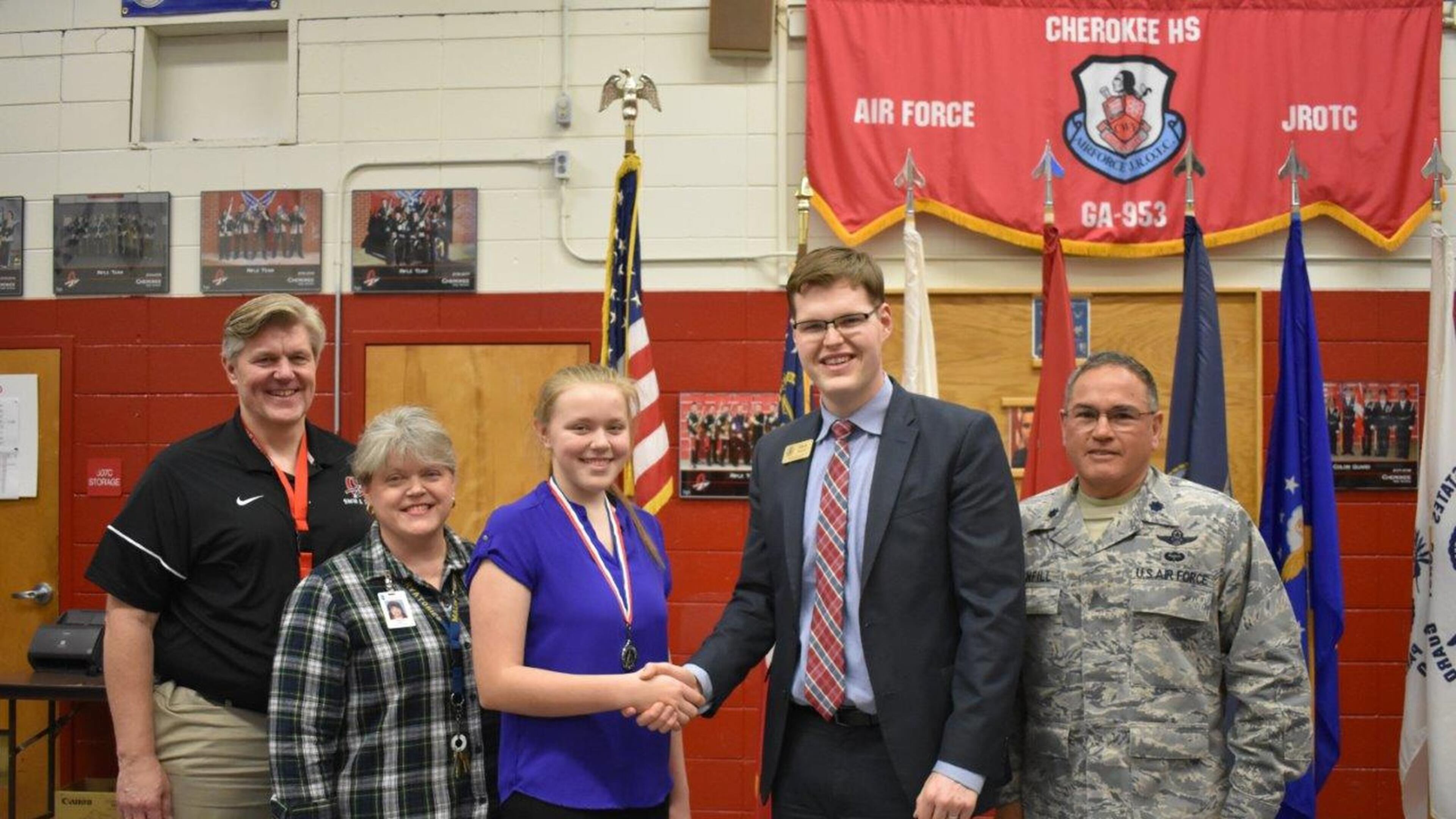 Cherokee High School sophomore Rebekah Seng was presented the Congressional Award, Silver Medal in February at the school by Georgia Congressman Barry Loudermilk’s Government Relations Director Mack Parnell. from left, Mark Seng, Virginia Seng, Rebekah Seng, Mack Parnell, Ret. Col. Eddy Stanfill.