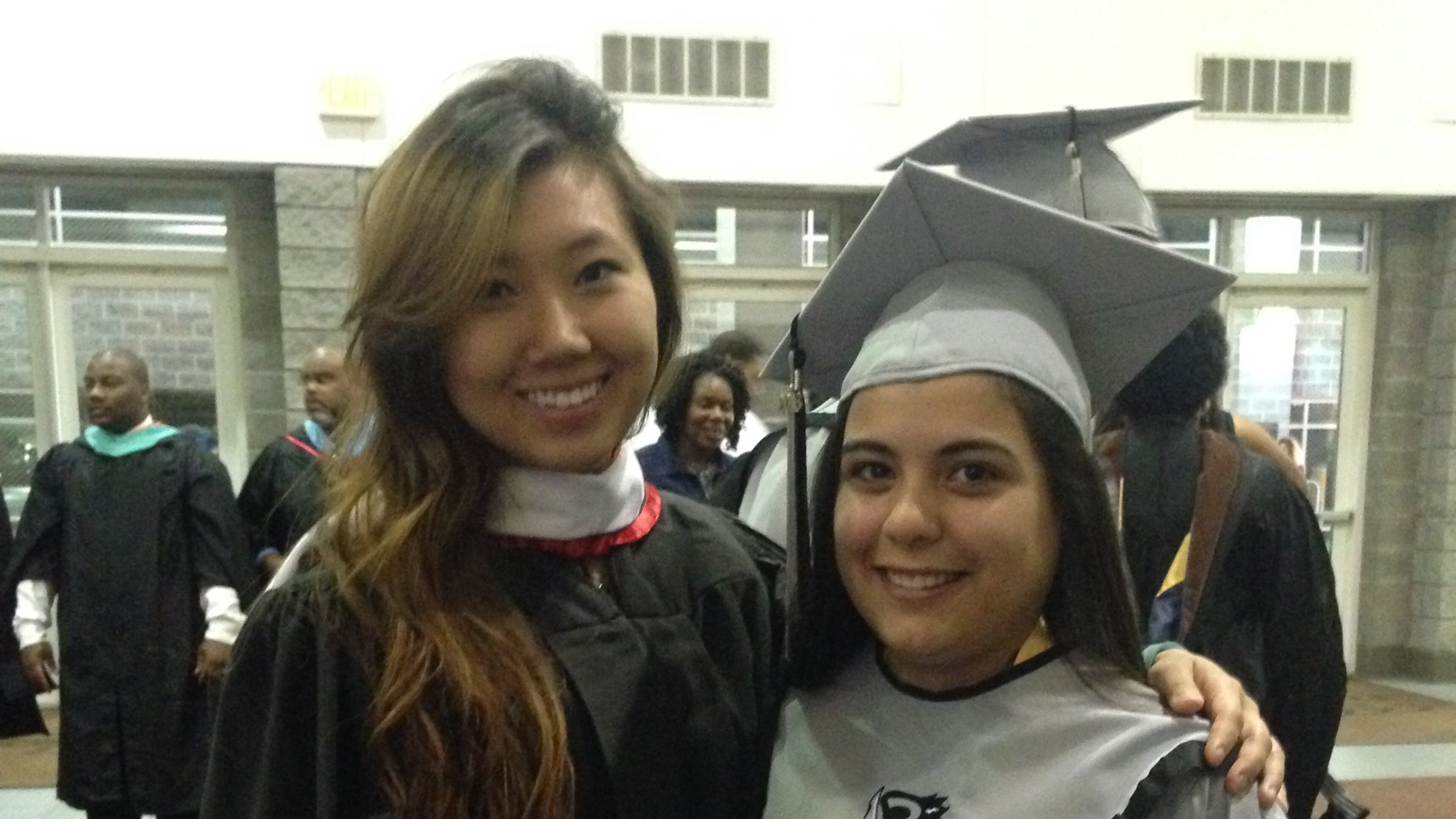 Teacher Grace Lee, shown with one of her students, says her brother's drawing of a red sun made his kindergarten teacher assume he could not follow directions.
