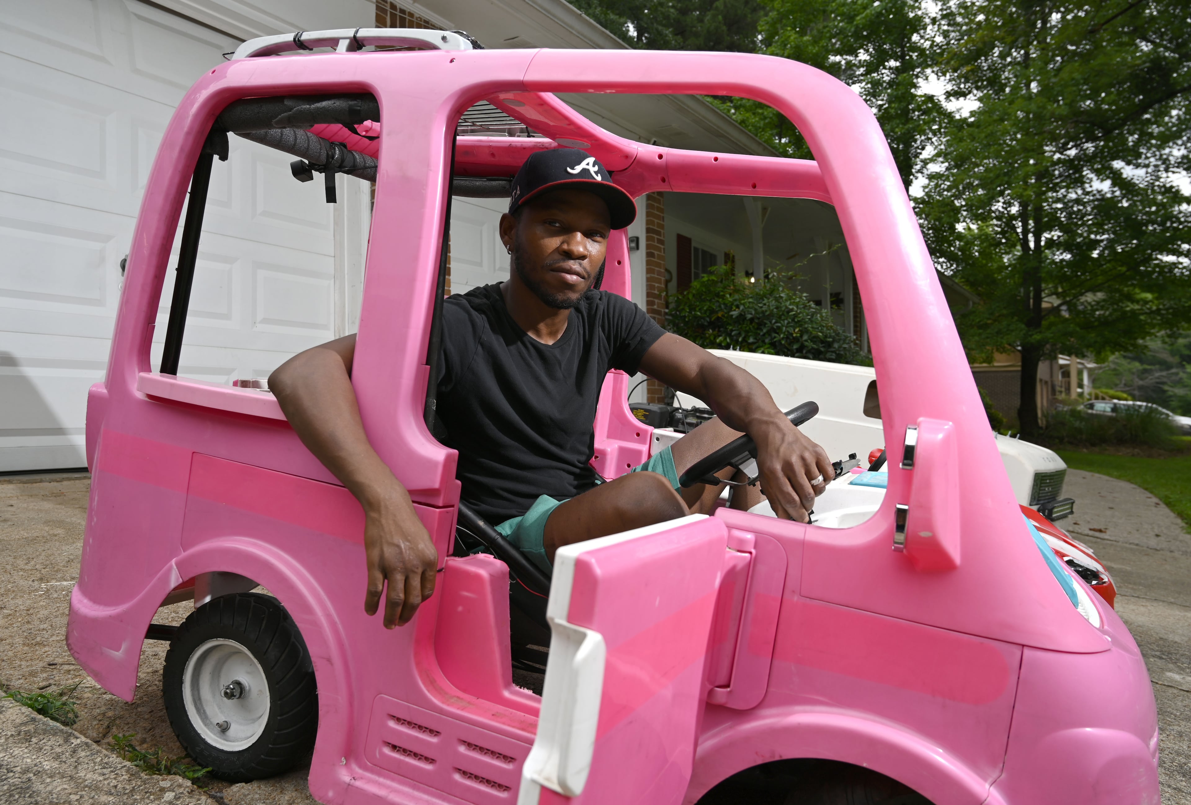Mali “Sota” Hightower's modified Barbie vehicle can reach speeds of 55 mph. (Hyosub Shin/AJC)