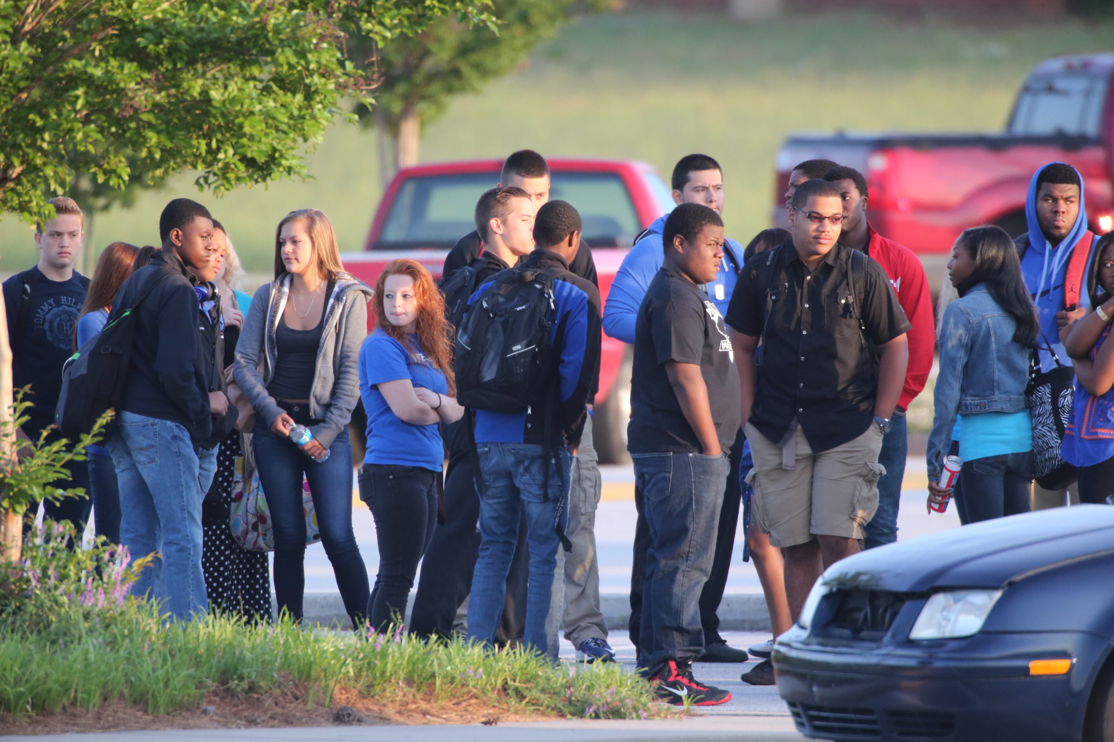 The scene at Dutchtown High School Thursday morning as students gathered before class after losing classmate in a Wednesday afternoon accident.