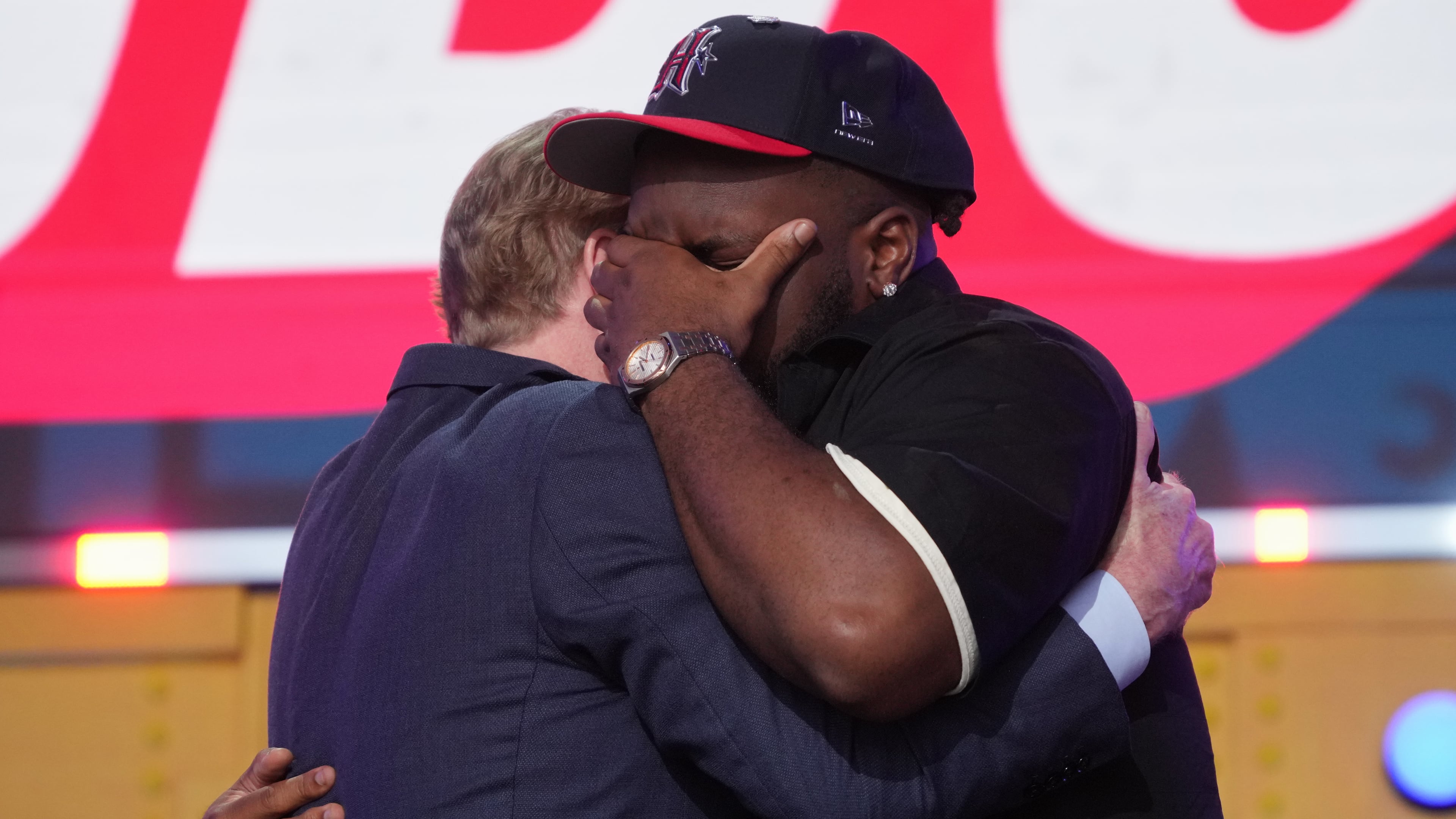 Ohio State defensive lineman Kayden McDonald, right, reacts with NFL Commissioner Roger Goodell after being chosen by the Houston Texans with the 36th overall pick during the second round of the NFL football draft, Friday, April 24, 2026, in Pittsburgh. (AP Photo/Gene J. Puskar)