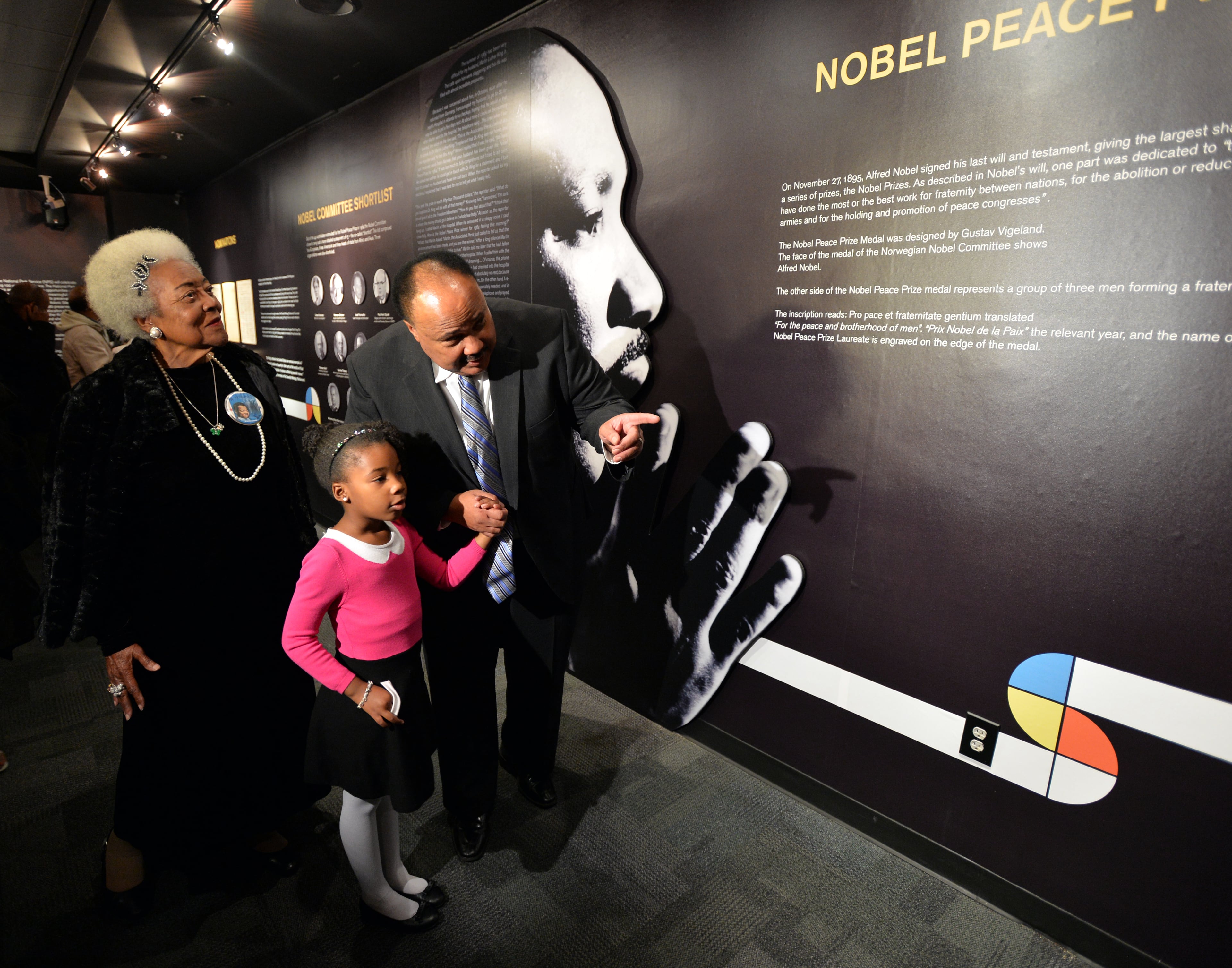 Yolanda Renee King, granddaughter of Martin Luther King Jr., takes a tour of the exhibit with her dad, Martin Luther King Jr. III. The two were attending the grand opening exhibition of "1964 Martin Luther King, Jr.", at the Martin Luther King, Jr. National Historic Site. Since 1964, the documents relating to the Nobel Peace Prize award nominations have been classified as a secret, and kept under lock and key in the Norwegian Nobel Committee's extensive archive. For the first time, the public now has access to this material. The exhibition features primary documents from the Nobel Peace Center in Oslo, Norway, Coca-Cola Corporate Archives, Ebenezer Baptist Church Archival Collections, Auburn Avenue Research Library on African American Culture and History, and Georgia State University Archival Collection. BRANT SANDERLIN / BSANDERLIN@AJC.COM