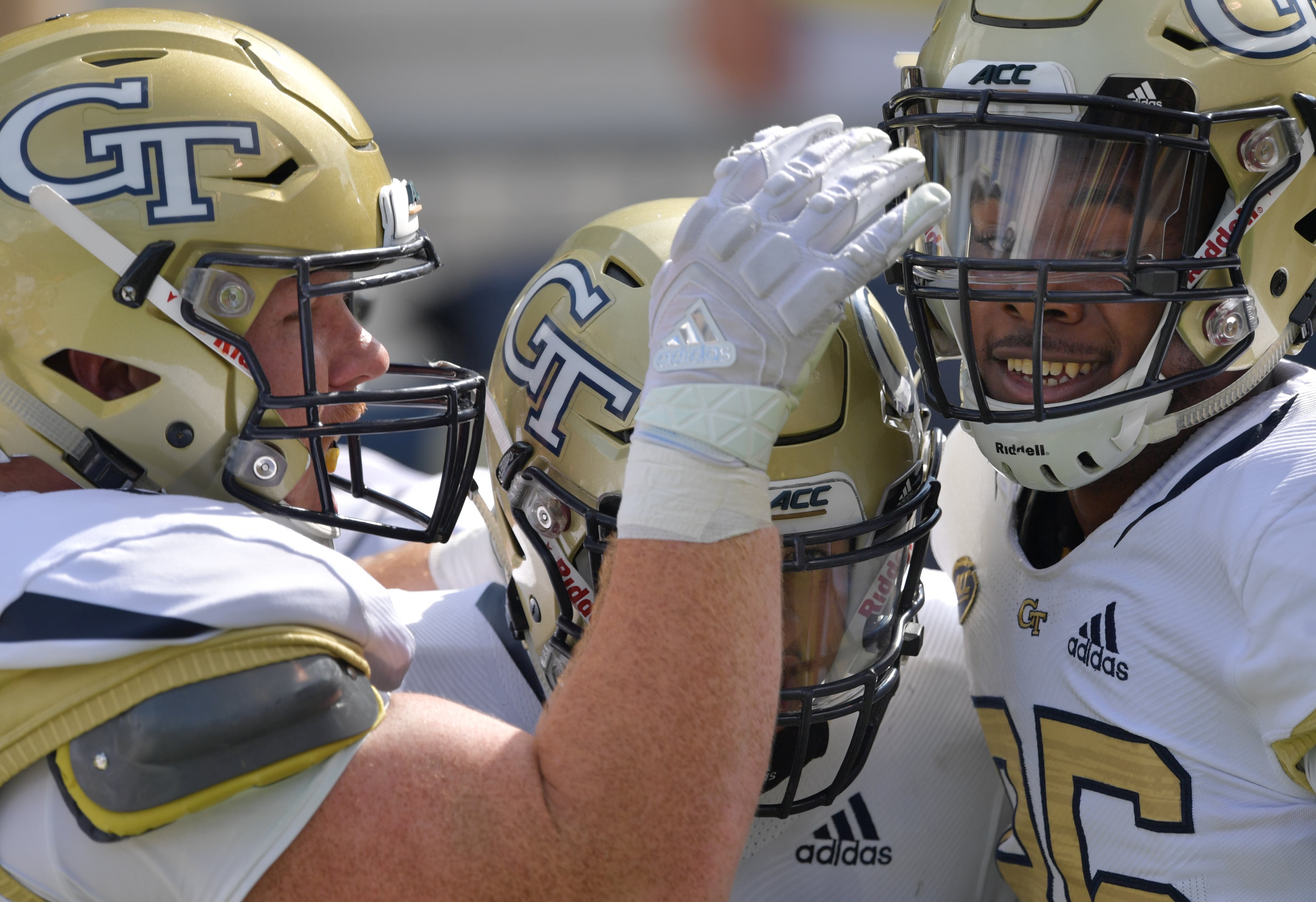 September 29, 2018 Atlanta - Georgia Tech quarterback Tobias Oliver (center) celebrates with teammates after he scored a touchdown in the second half at Bobby Dodd Stadium on Saturday, September 29, 2018. Georgia Tech won 63-17 over the Bowling Green. HYOSUB SHIN / HSHIN@AJC.COM