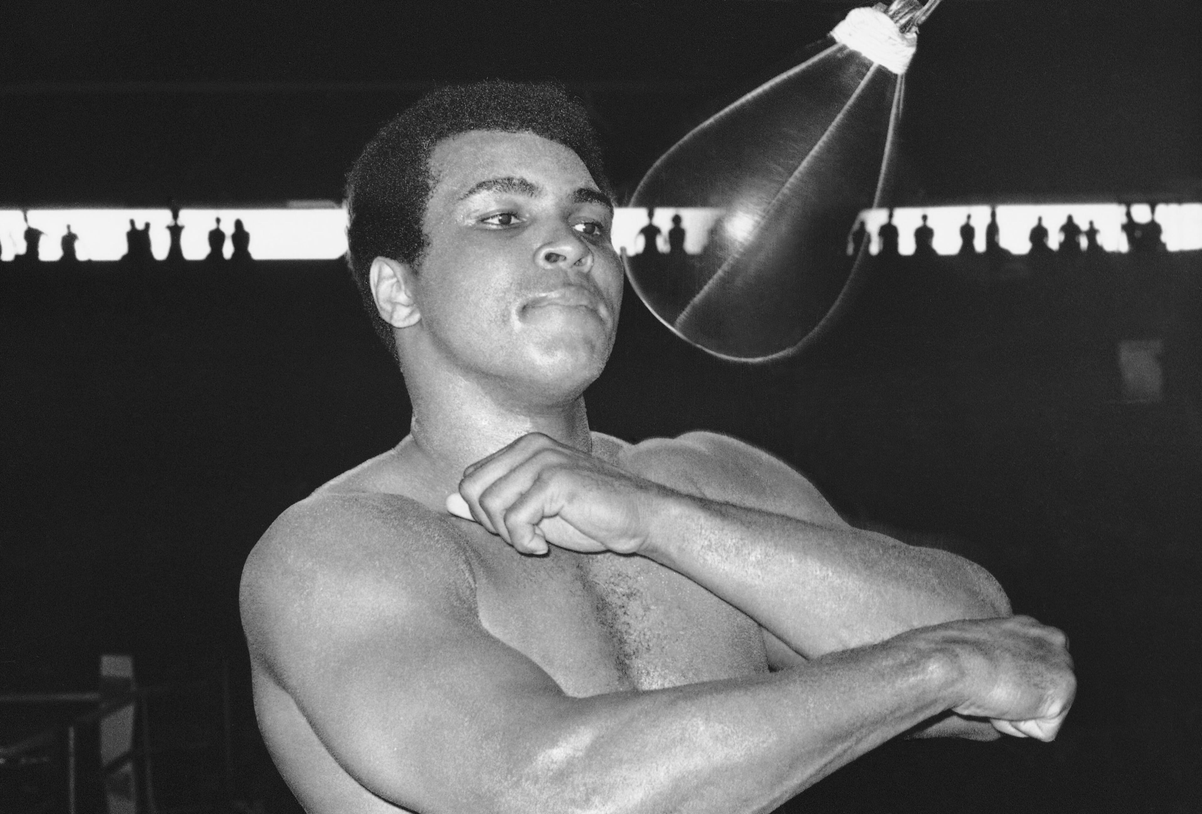 Muhammad Ali prepares for his title fight against Joe Frazier in Manila, Philippines, in 1975. (Jess Tan / AP file)