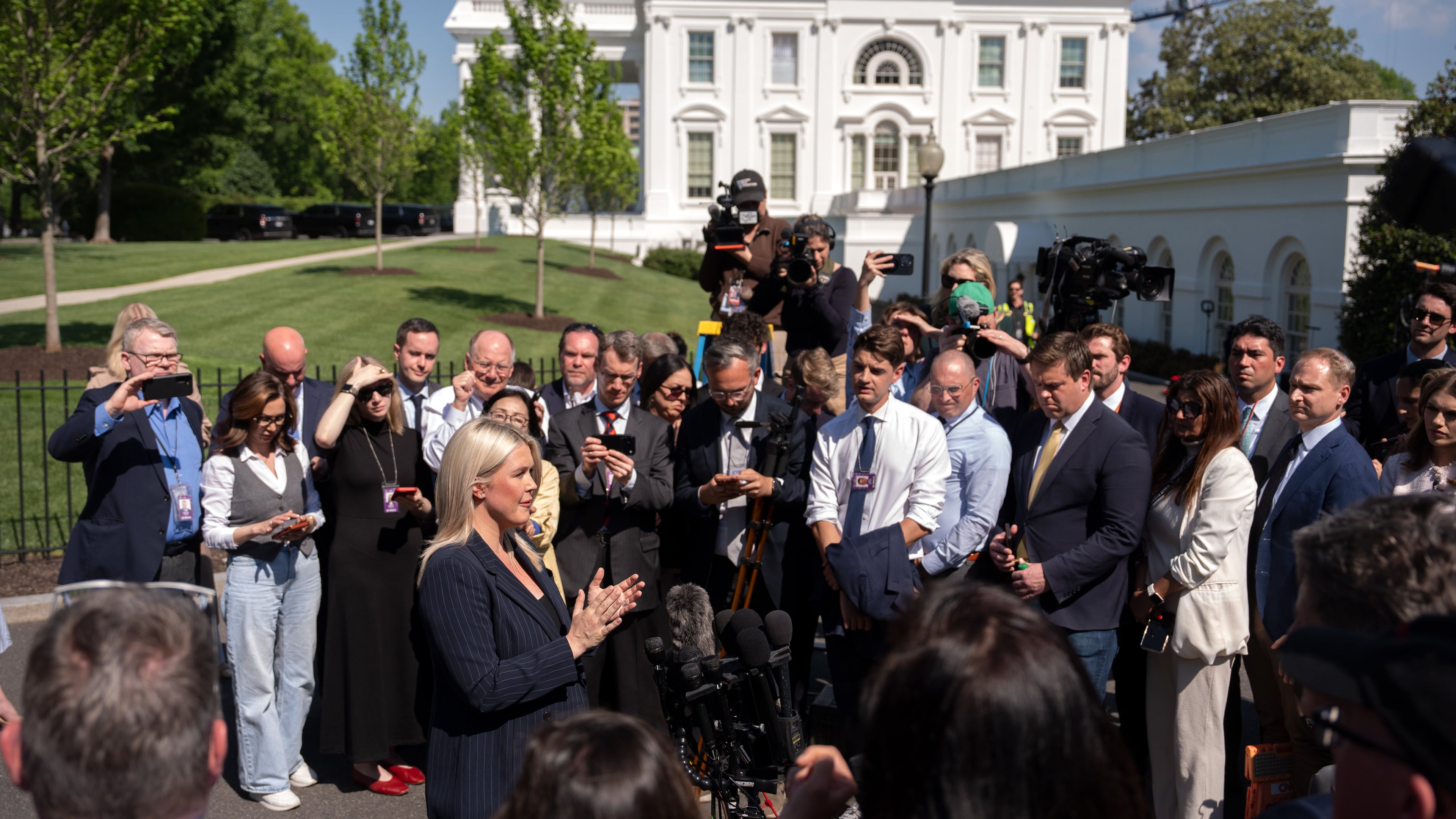 White House press secretary Karoline Leavitt speaks with reporters outside the White House, Wednesday, April 22, 2026, in Washington. (AP Photo/Mark Schiefelbein)