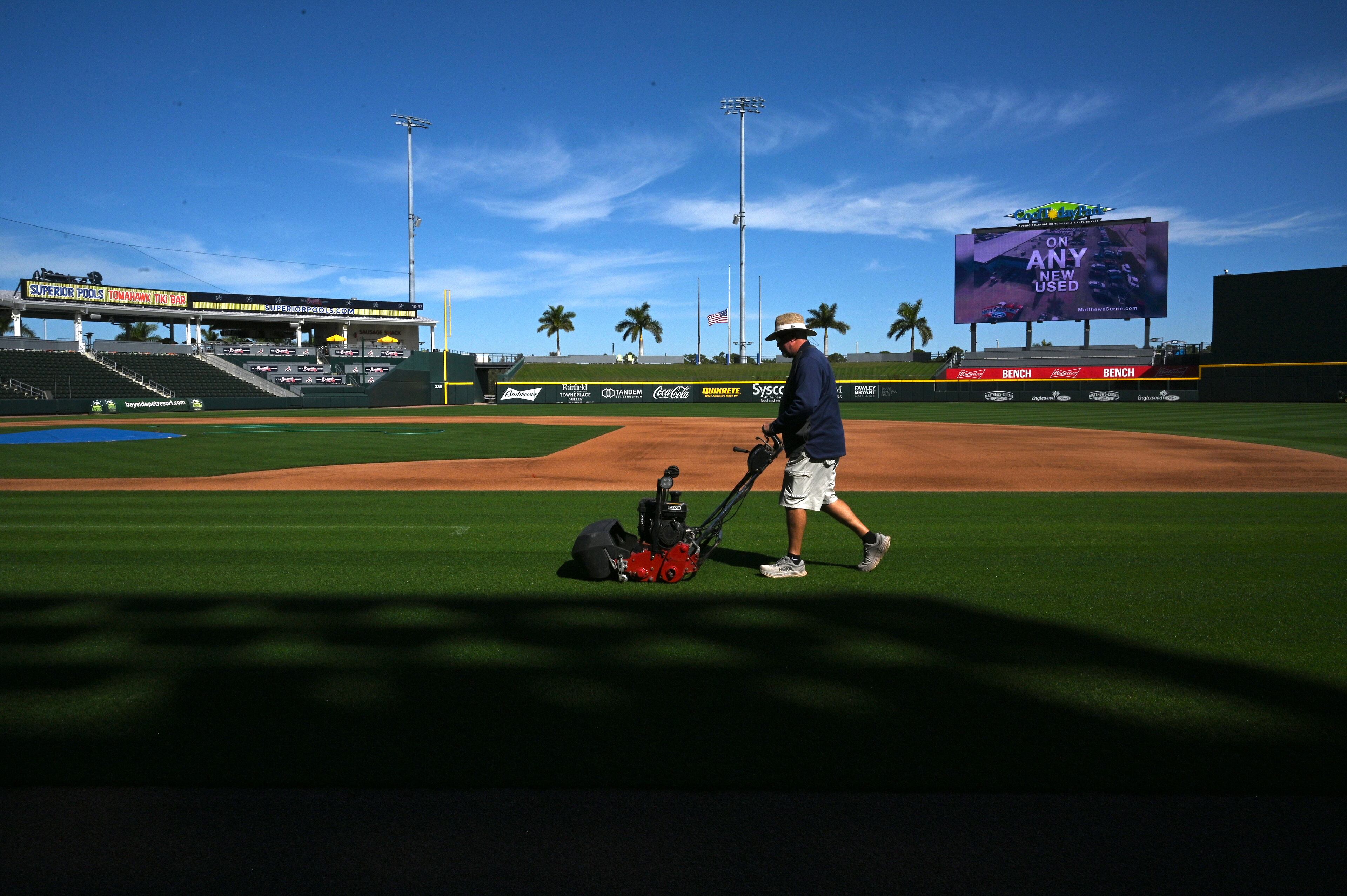 A member of ground crew works on the baseball field during spring training at CoolToday Park in North Port, Florida on Wednesday, Feb., 14, 2024. (Hyosub Shin / Hyosub.Shin@ajc.com)