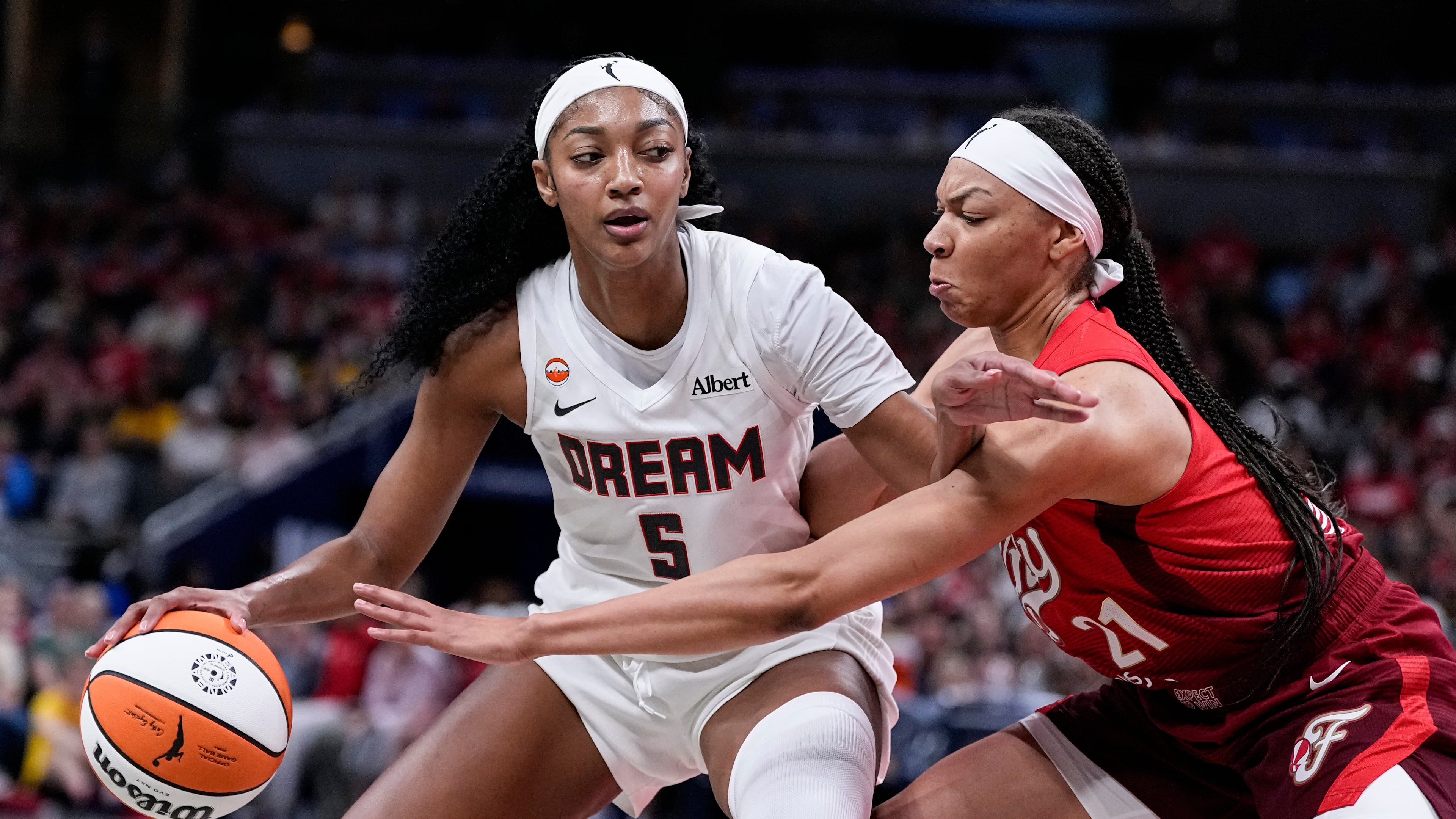 Atlanta Dream forward Angel Reese (5) works around Indiana Fever forward Makayla Timpson (21) in the second half of a WNBA basketball game in Indianapolis, Thursday, June 18, 2026. Reese led the Dream with 21 points and added 11 rebounds on Thursday night. (Michael Conroy/AP)