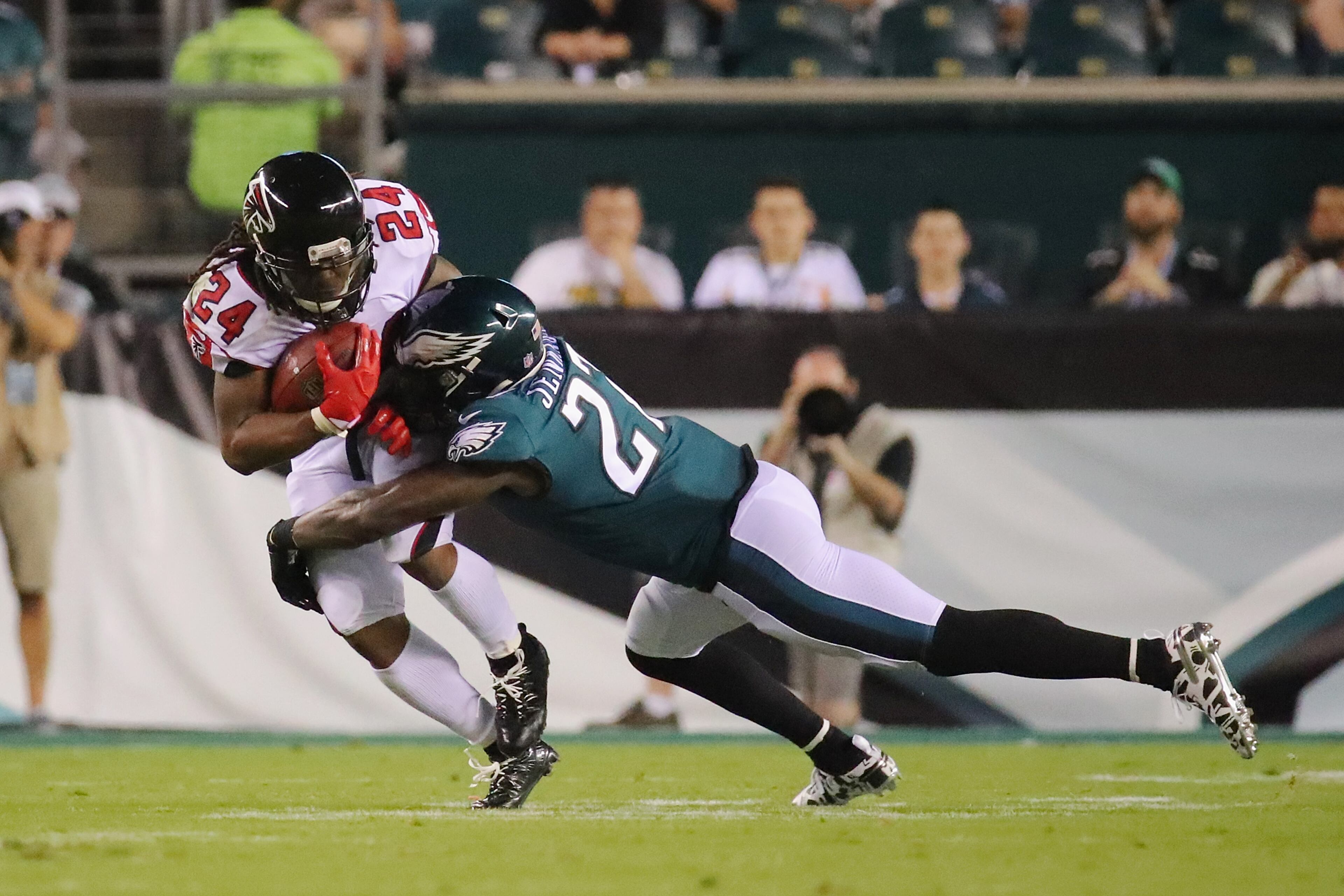 PHILADELPHIA, PA - SEPTEMBER 06: Malcolm Jenkins #27 of the Philadelphia Eagles tackles Devonta Freeman #24 of the Atlanta Falcons during the first half at Lincoln Financial Field on September 6, 2018 in Philadelphia, Pennsylvania. (Photo by Brett Carlsen/Getty Images)