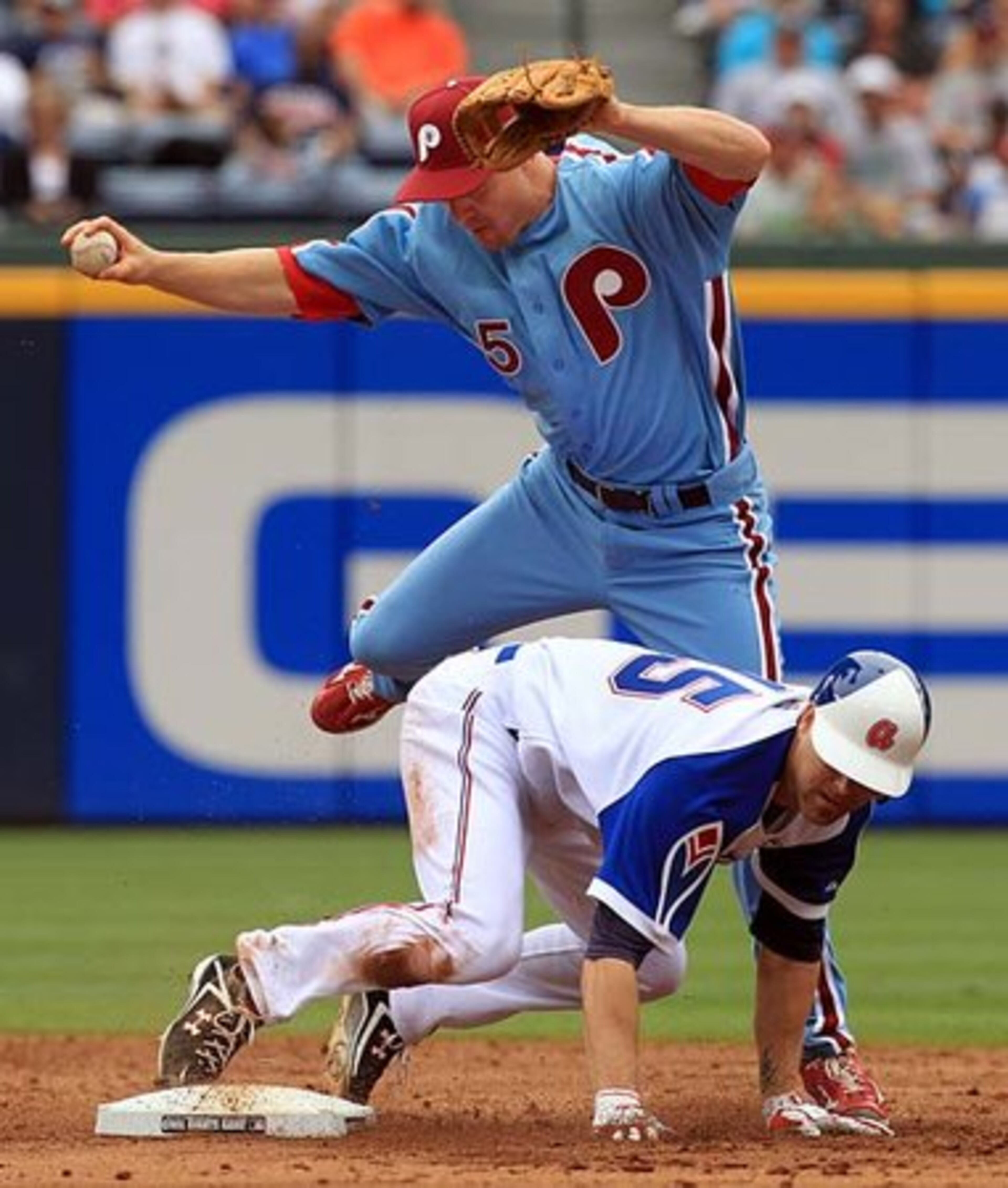 Braves pitcher Tim Hudson breaks up a double play attempt, nearly up-ending Philadelphia's Pete Orr at second base on a single by Martin Prado during the 3rd inning.