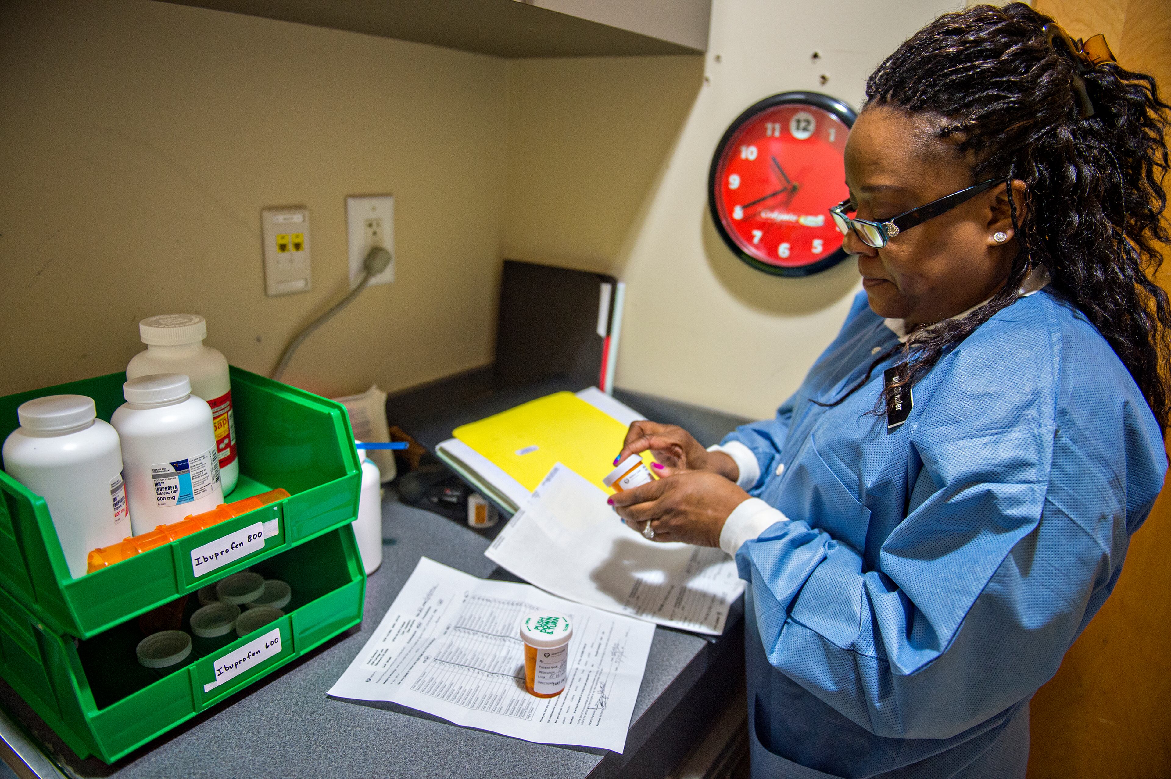 Dr. Katrina Schuler-Bacon fills a prescription for one of her patients at the Mercy Care free dental clinic in Atlanta on Tuesday, May 19. Four and a half million Georgians lack dental insurance, and many of them haven’t seen a dentist in decades. JONATHAN PHILLIPS / SPECIAL