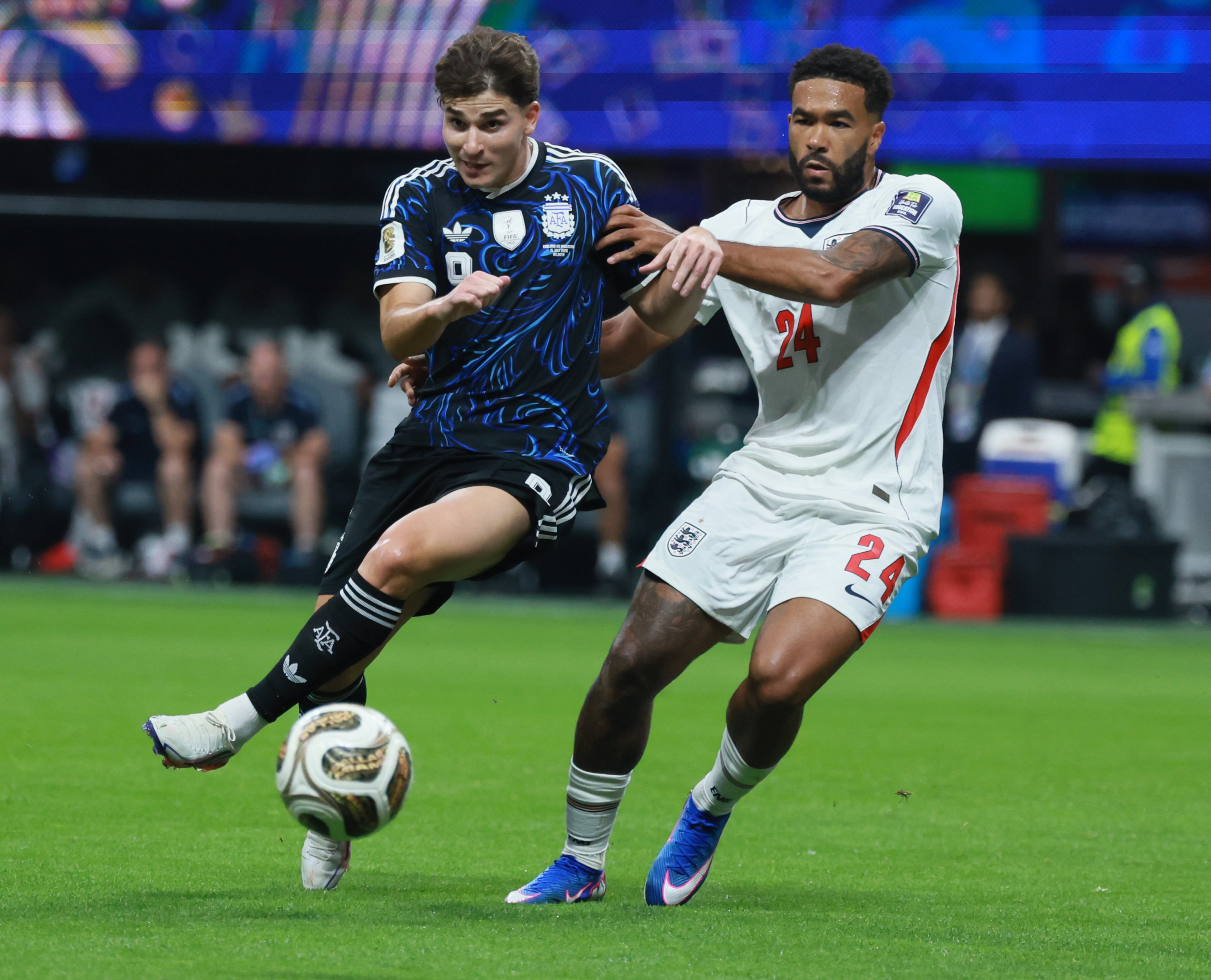Argentina's Julian Alvarez, left battles England's Reece James for ball during first half of Argentina vs. England FIFA World Cup Semifinal match at Atlanta Stadium (Mercedes-Benz Stadium) on Wednesday, July 15, 2026. (Jason Getz/AJC)