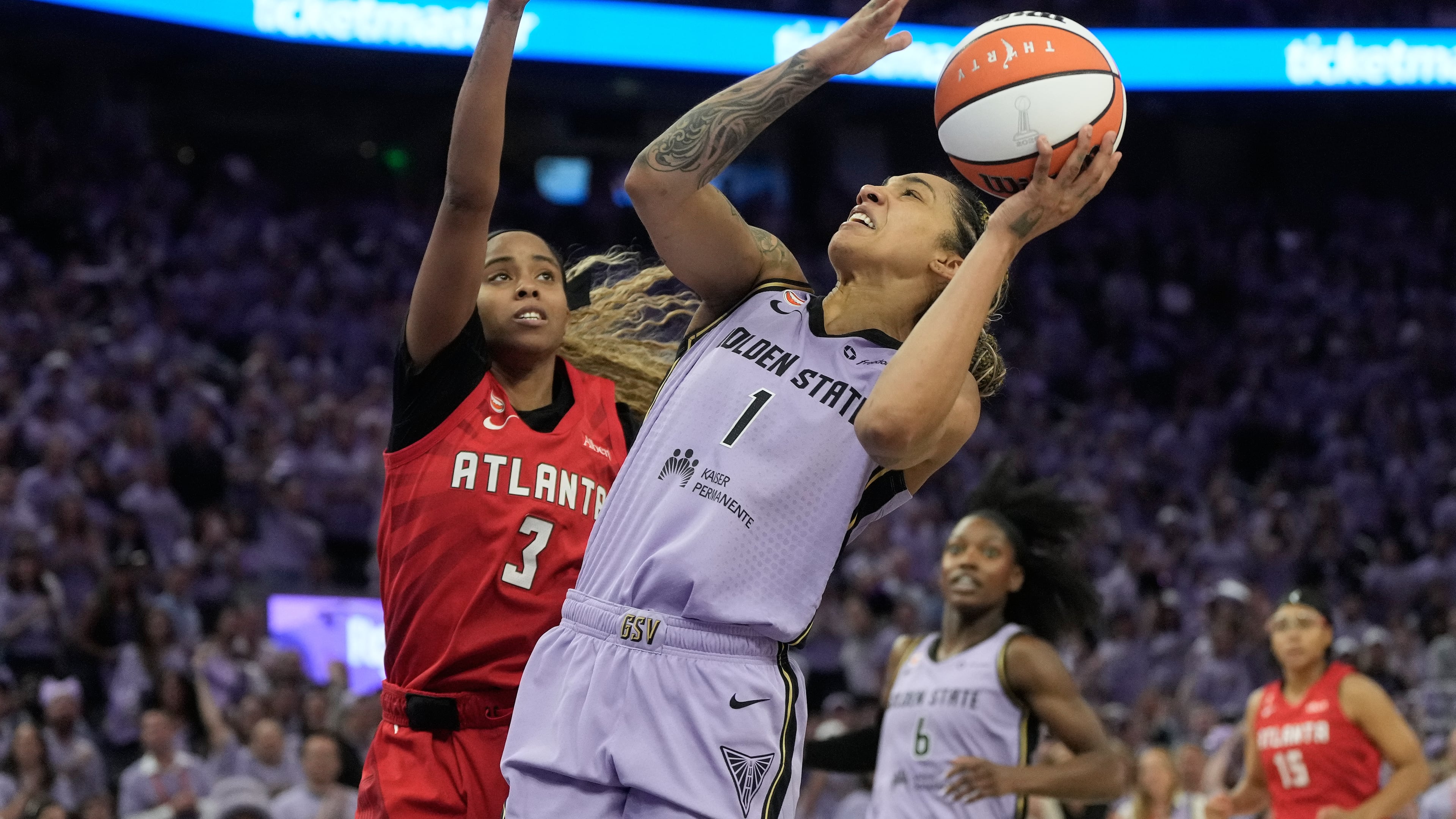 Golden State Valkyries forward Gabby Williams (1) shoots against Atlanta Dream guard Jordin Canada (3) during the first half of Game 1 of the WNBA basketball finals, Saturday, Oct. 17, 2026, in San Francisco. (AP Photo/Jeff Chiu)