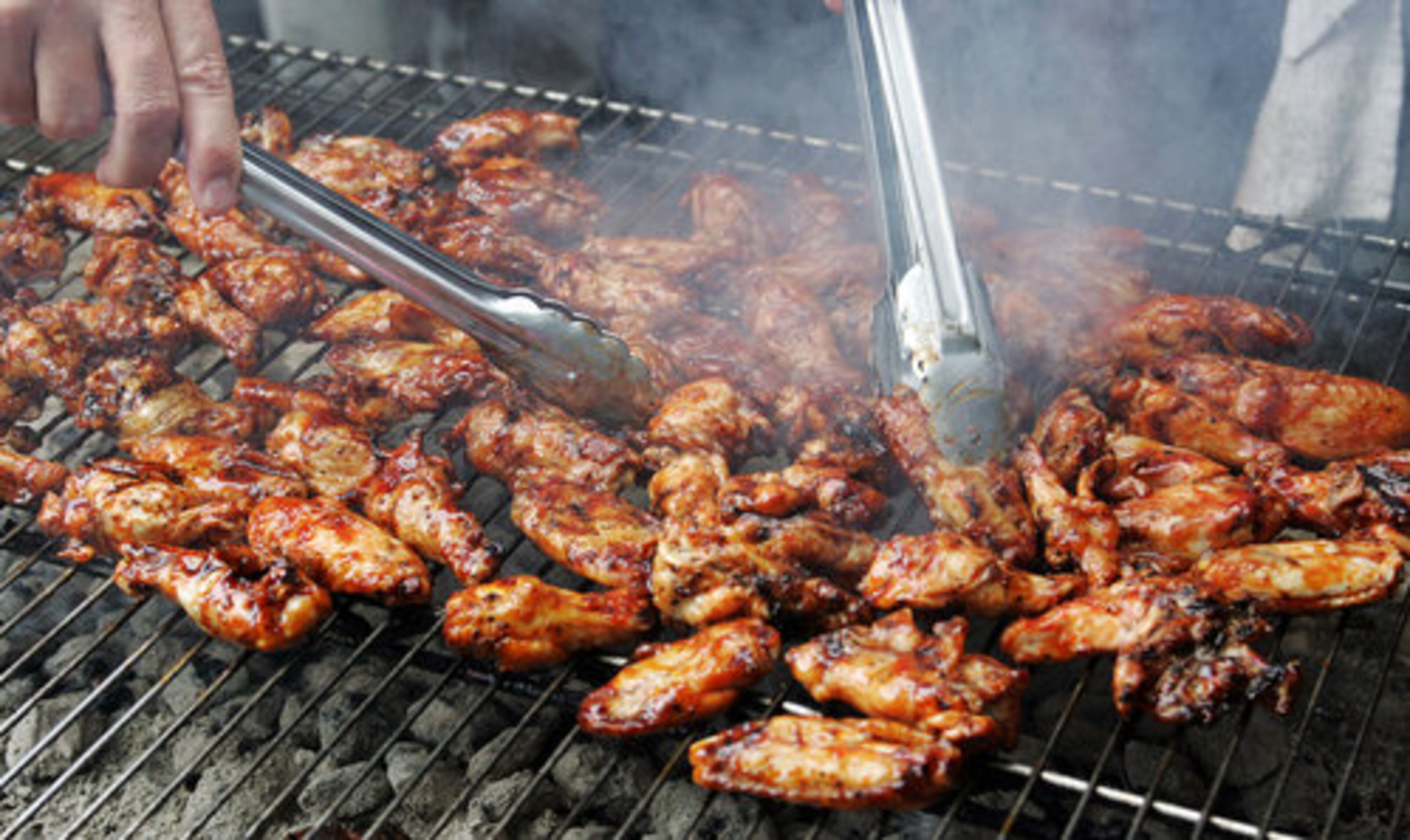 In addition to preparing ribs and chicken, Huff demonstrates cooking methods for Boston butt, beef brisket and traditional sides like cole slaw and baked beans.