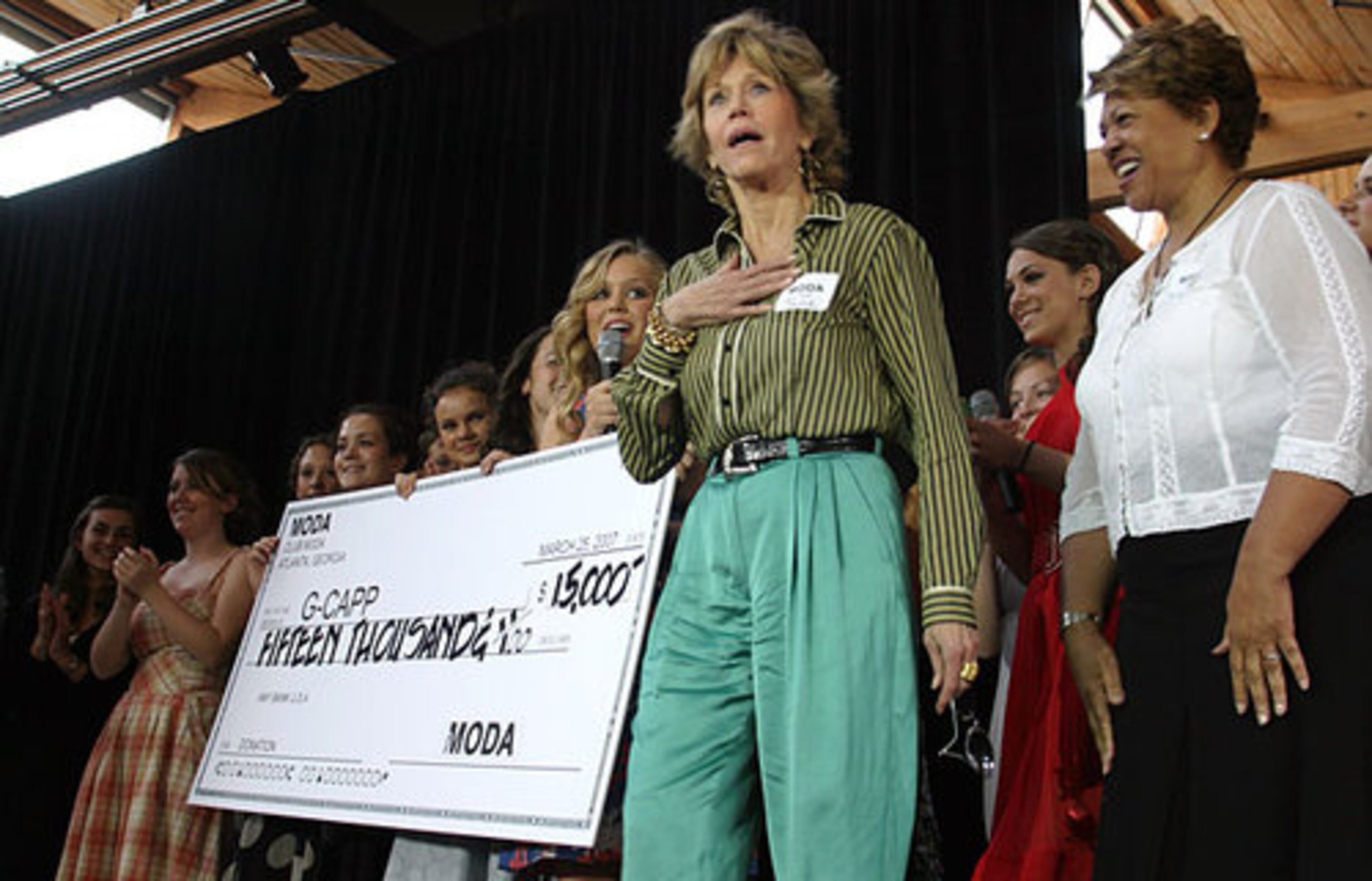 Fonda was shocked as she was presented with a check from students in Paideia High School's fashion/design club to go towards G-CAPP in 2007.