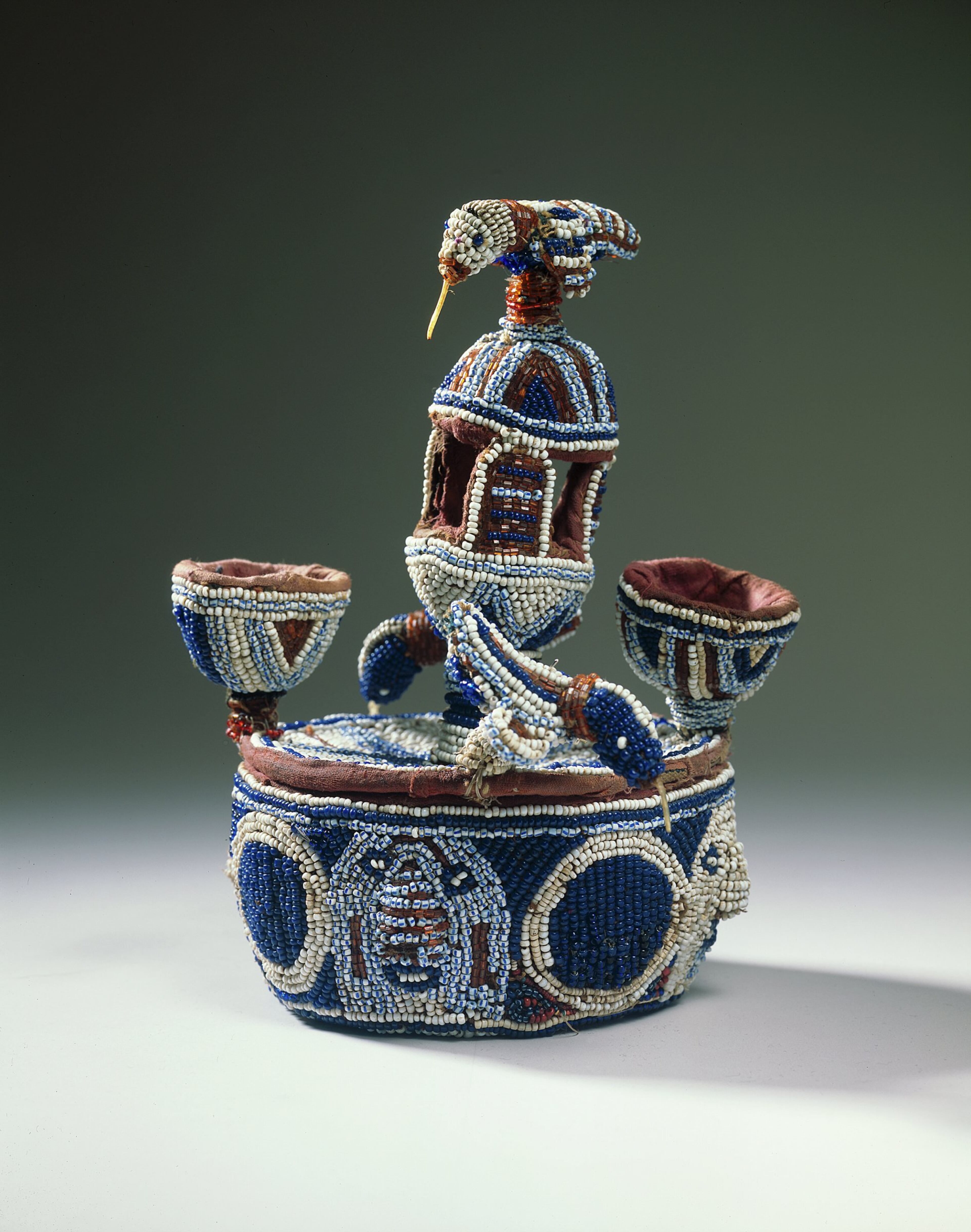 An unknown Nigerian artist made this vessel of leather, glass beads, cloth and fiber in the 20th century.
Said Baeza: "This vessel is another example of masterful Yoruba glass beadwork."