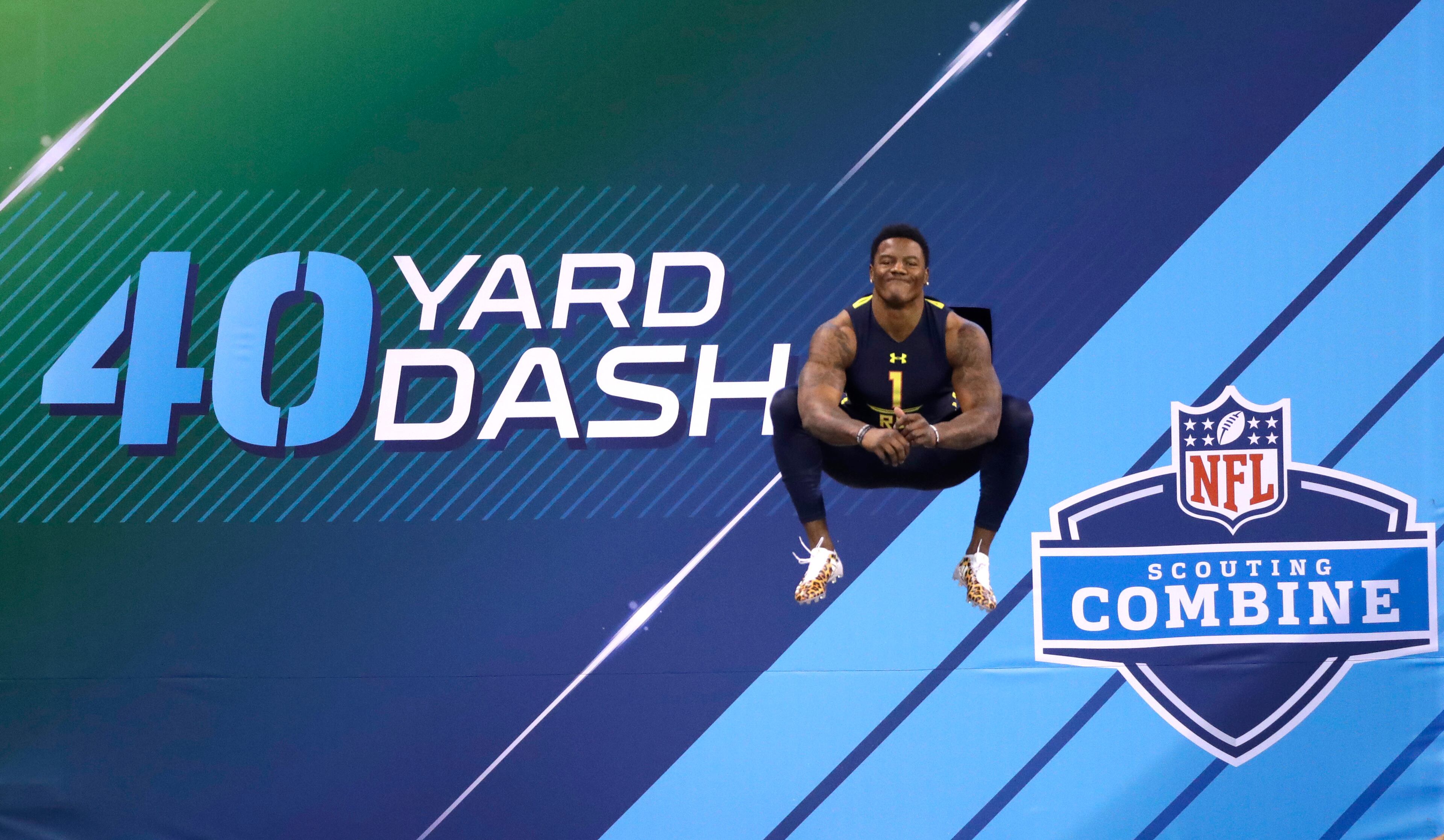 Oklahoma State running back Christopher Carson prepares to run the 40-yard dash at the NFL football scouting combine Friday, March 3, 2017, in Indianapolis. (AP Photo/David J. Phillip)