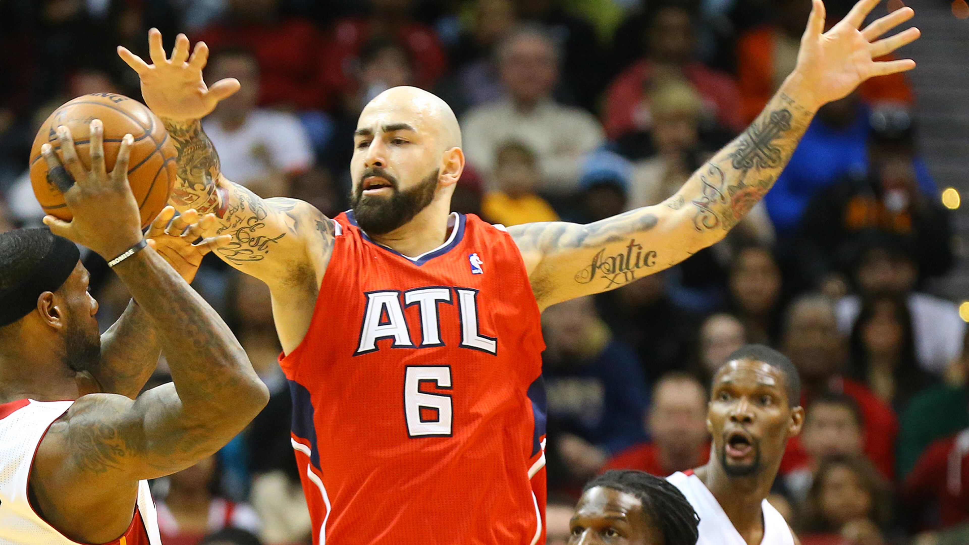 012014 ATLANTA: Hawks center Pero Antic defends against Heat forward LeBron James forcing him to pass it off during the first half of their NBA basketball game on Monday, Jan. 20, 2014, in Atlanta. CURTIS COMPTON / CCOMPTON@AJC.COM