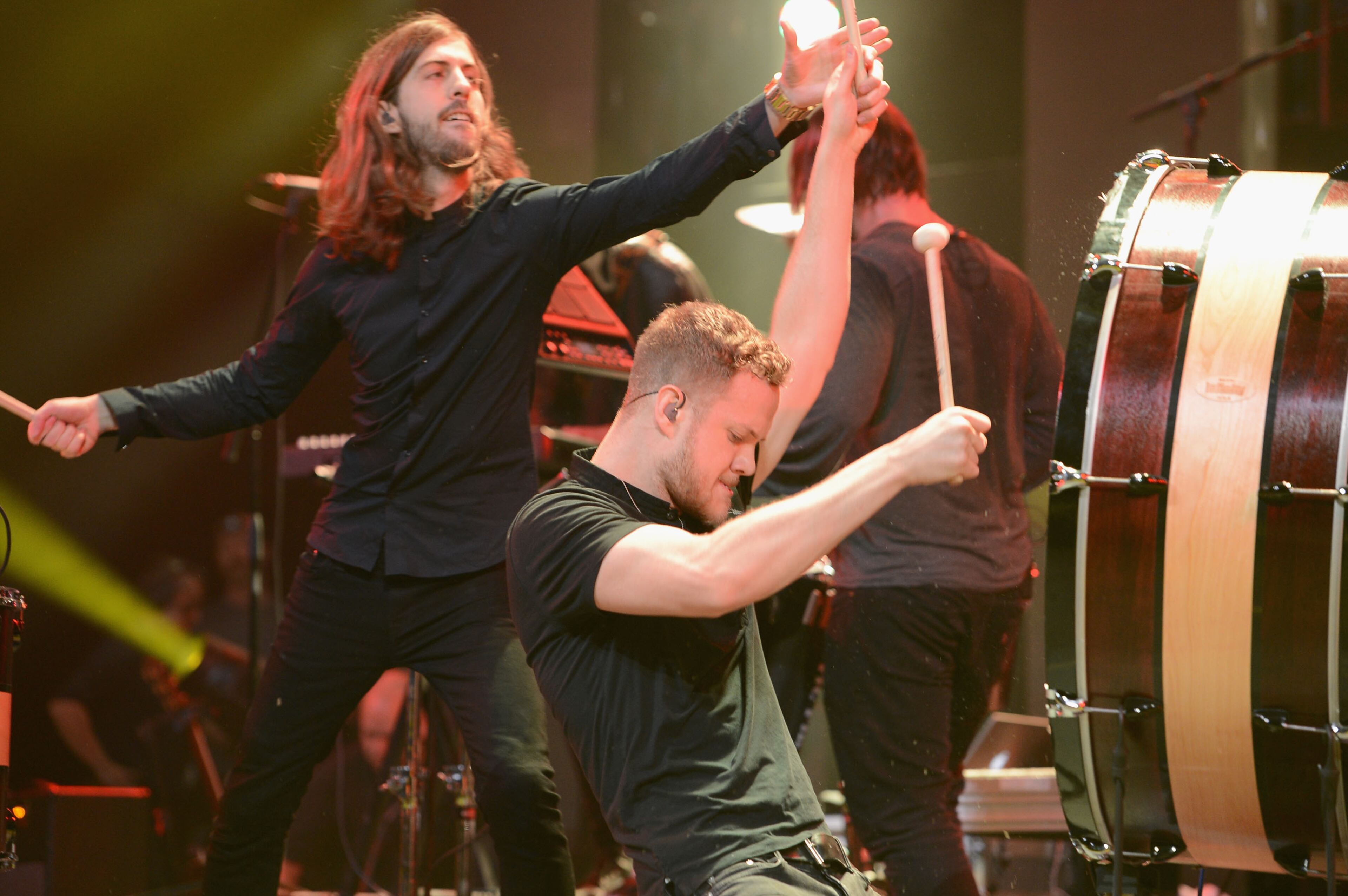 Wayne Sermon (L) and Dan Reynolds of Imagine Dragons perform onstage at the Amnesty International Concert presented by the CBGB Festival at Barclays Center on February 5, 2014 in New York City.