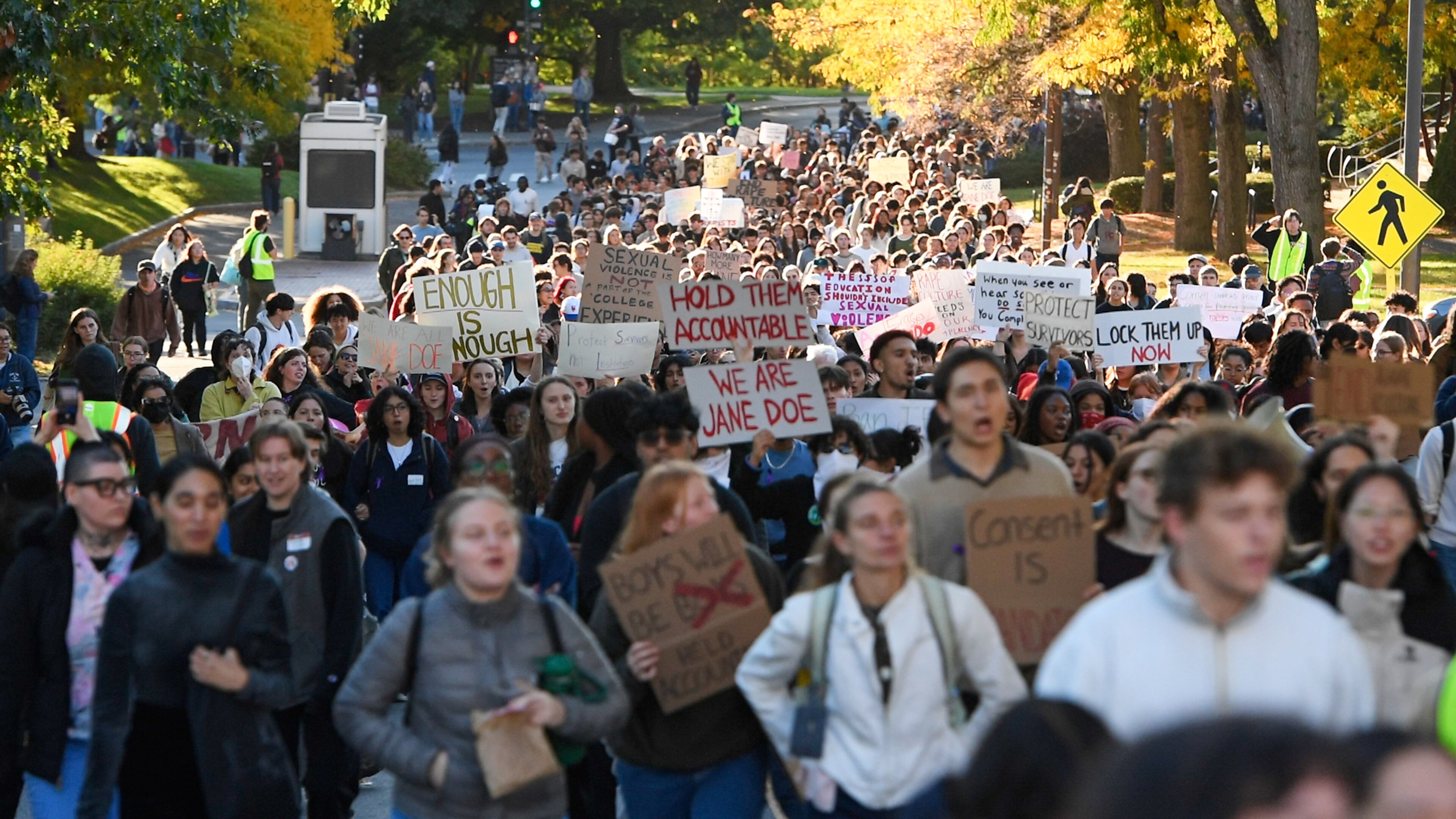 Demonstrators march during a protest against Cornell University's handling of the 2024 fraternity-house gang rape allegations at the campus, Monday, Oct. 5, 2026, in Ithaca, N.Y. The case has revived a perennial, painful debate on American college campuses about the role of Greek life and how to manage it when things go wrong. (AP Photo/Adrian Kraus)