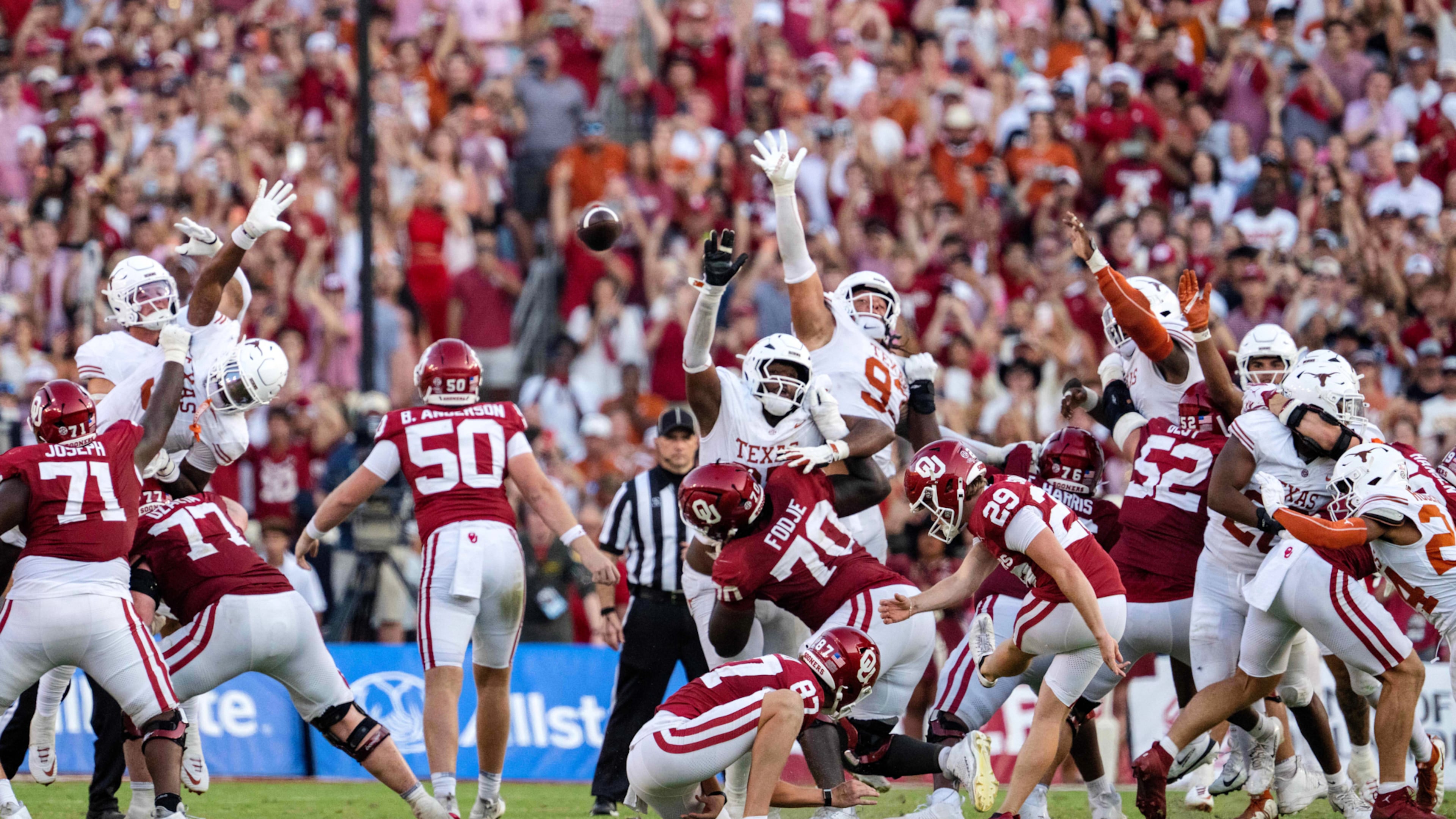 Oklahoma kicker Tate Sandell (29) kicks the game-winning field goal as time expires in the second half of an NCAA college football game against Texas, Saturday, Oct. 10, 2026, in Dallas. (AP Photo/Jeffrey McWhorter)