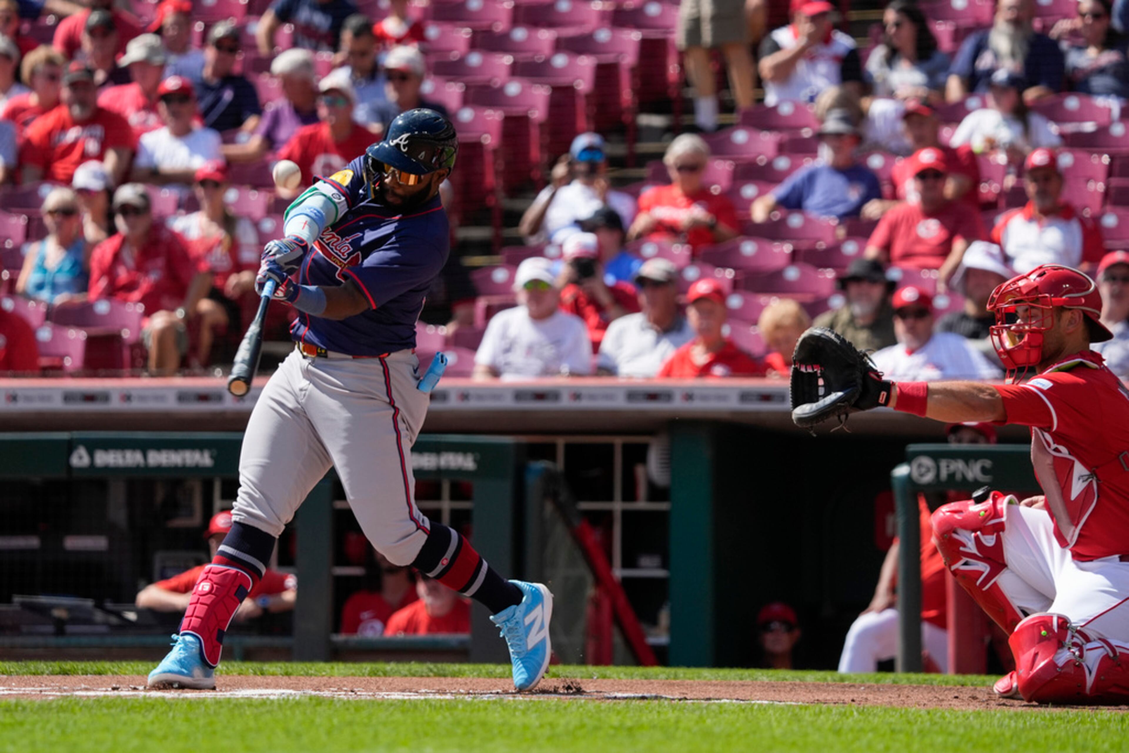 Atlanta Braves' Michael Harris II, left, swings at a pitch during the first inning of a baseball game against the Cincinnati Reds, Thursday, Sept. 19, 2024, in Cincinnati. (AP Photo/Joshua A. Bickel)