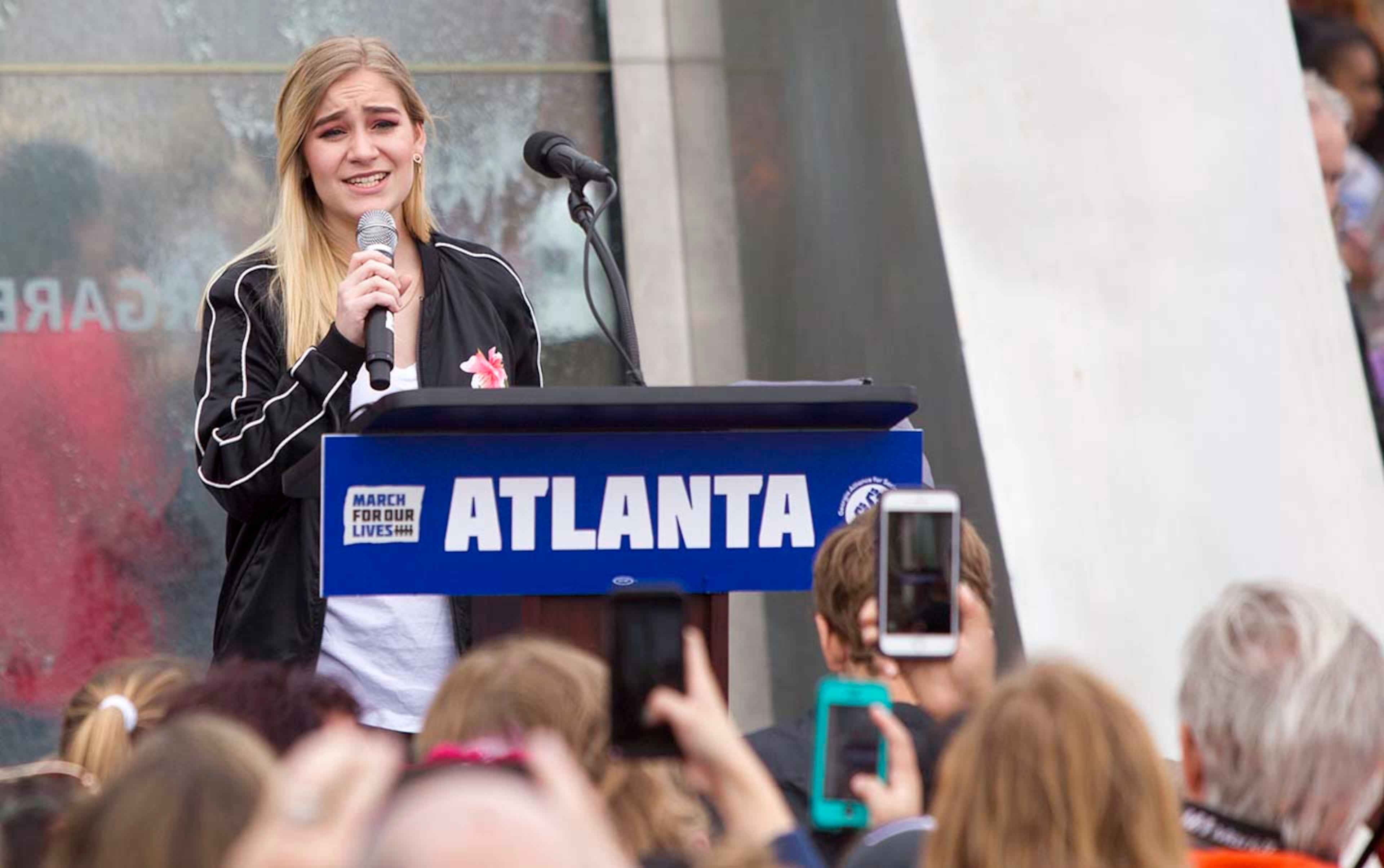 Vienne Borg, a student at Centennial High, sings an original song of hers during the March for our Lives event in Atlanta, Georgia, on Saturday, March 24, 2018. (REANN HUBER/REANN.HUBER@AJC.COM)