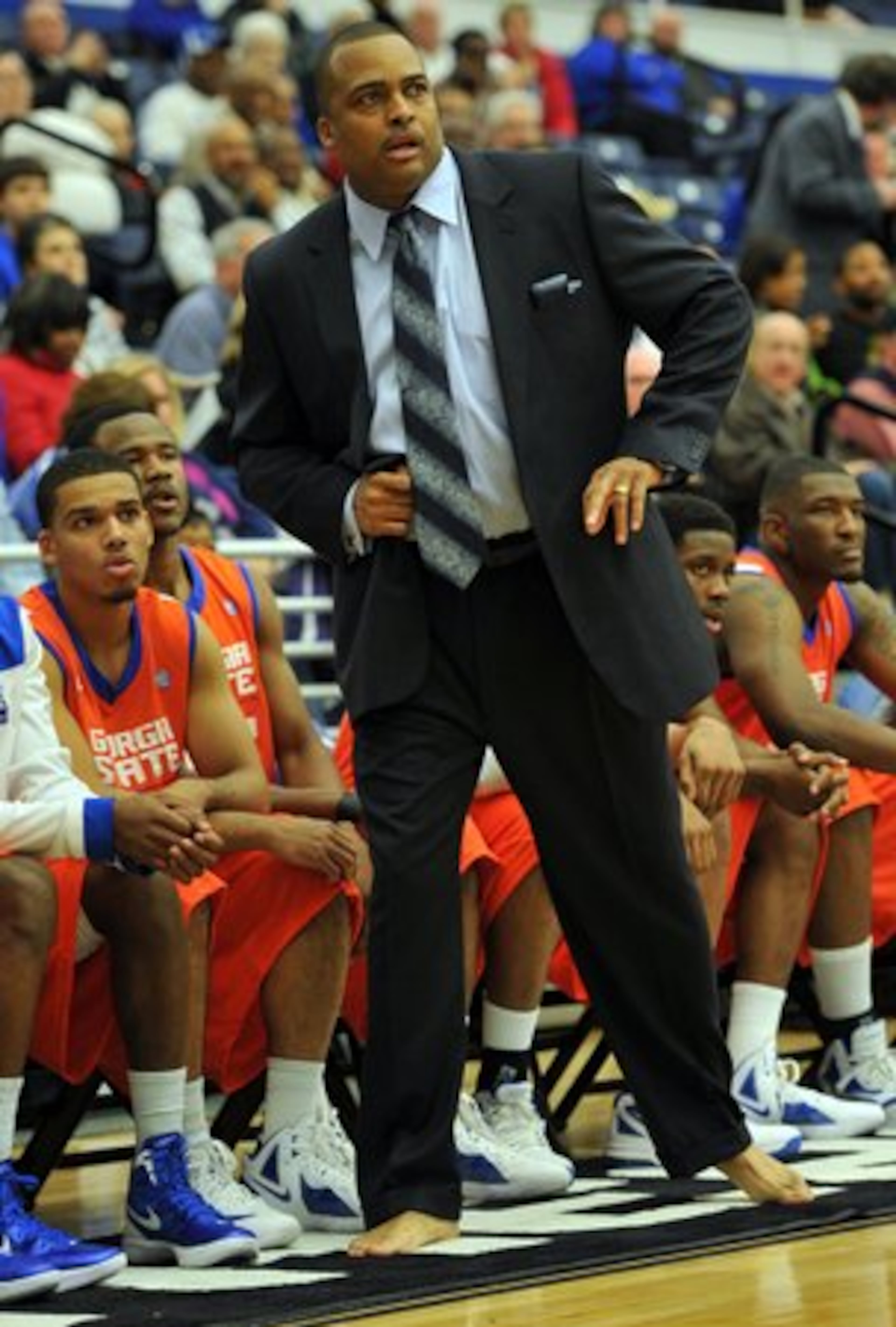 Georgia State head coach Ron Hunter coaches barefoot in the first half against the North Carolina-Wilmington at GSU Sports Arena in Atlanta on Thursday, January 12, 2011. Coach Ron Hunter raises funds for charity by coaching barefoot.