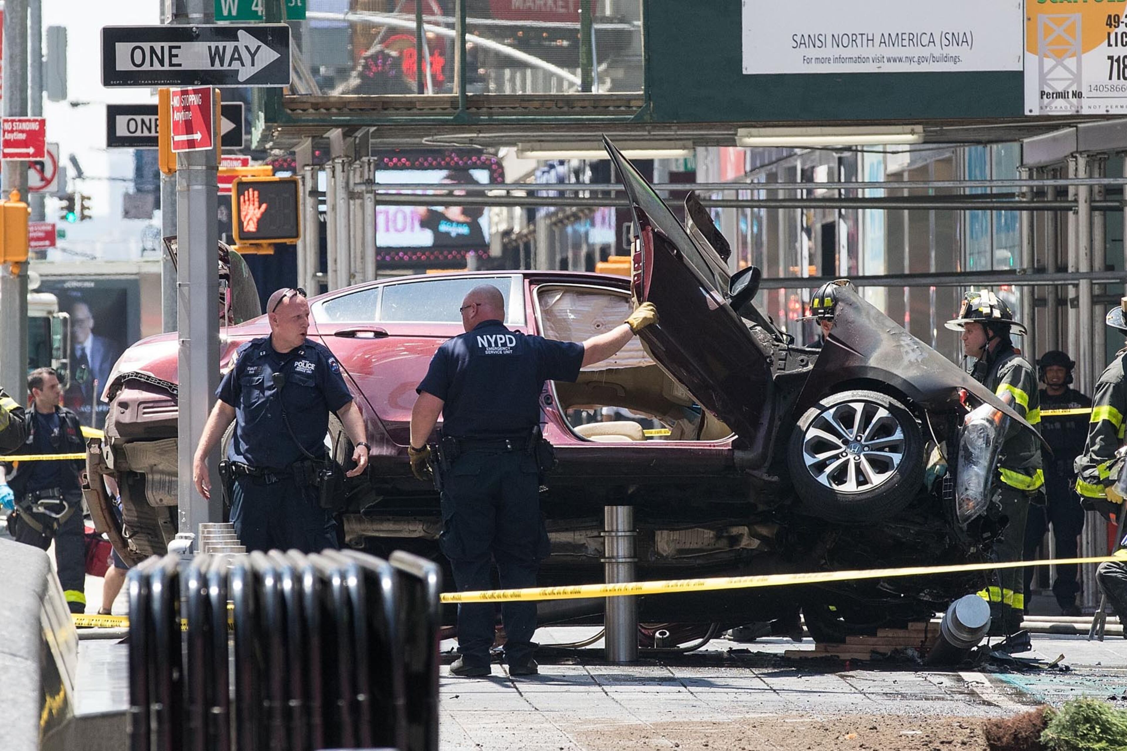 NEW YORK, NY - MAY 18: A wrecked car sits in the intersection of 45th and Broadway in Times Square, May 18, 2017 in New York City. According to reports there were multiple injuries and one fatality after the car plowed into a crowd of people. (Photo by Drew Angerer/Getty Images)