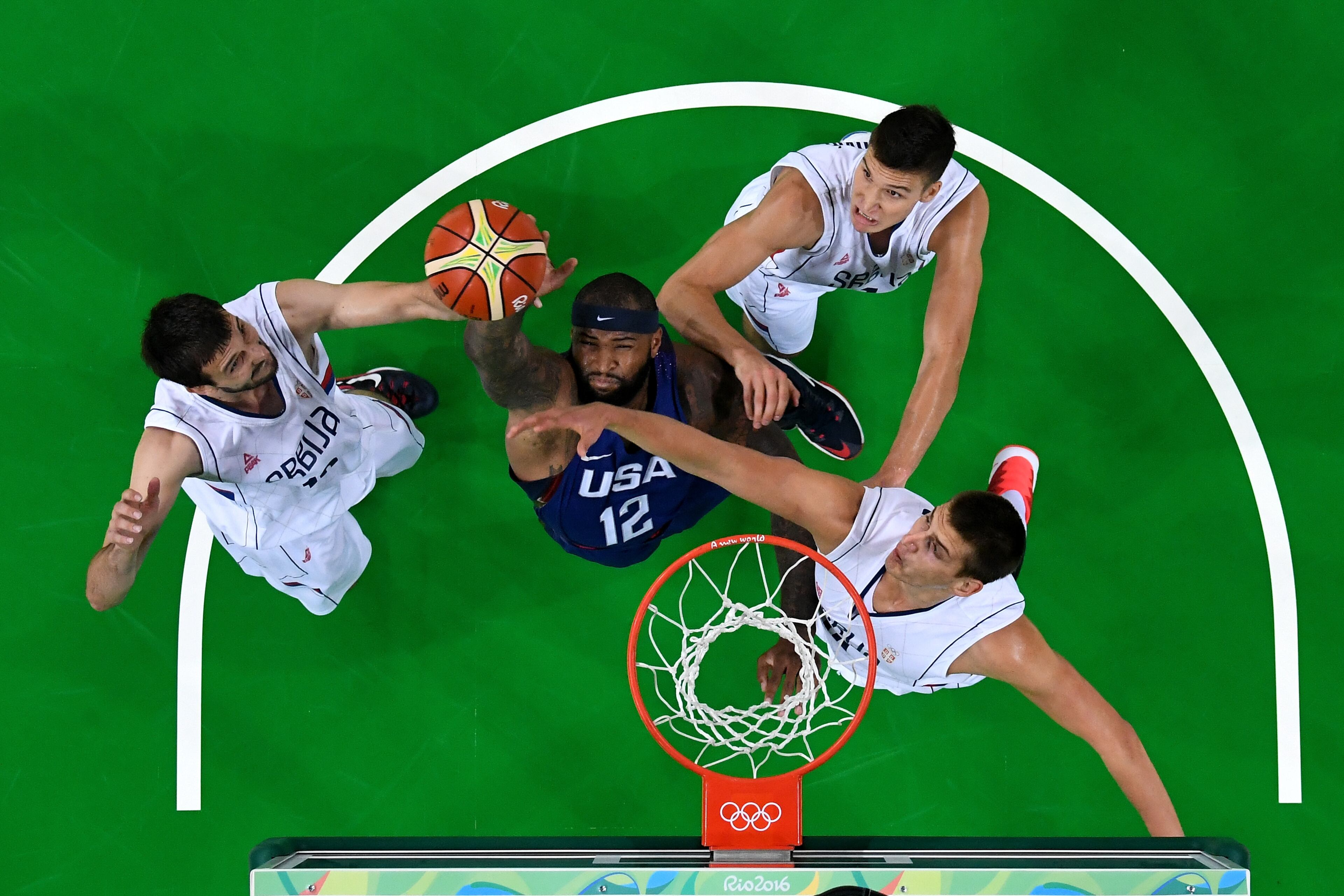 RIO DE JANEIRO, BRAZIL - AUGUST 21: Demarcus Cousins #12 of United States grabs a rebound against Serbia during the Men's Gold medal game on Day 16 of the Rio 2016 Olympic Games at Carioca Arena 1 on August 21, 2016 in Rio de Janeiro, Brazil. (Photo by Pool/Getty Images)