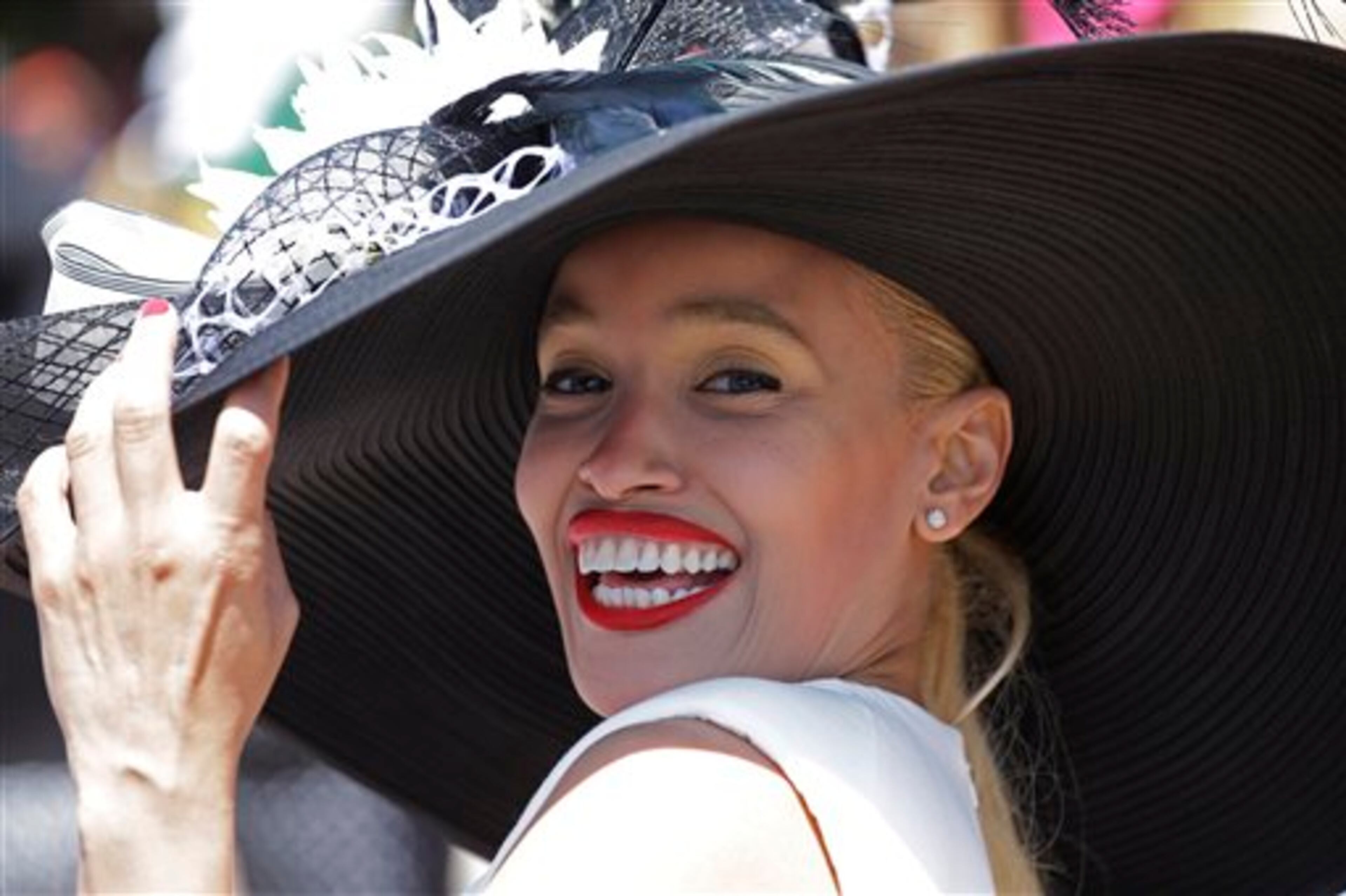 Katiana Garcia De La Rosa of Spain wears a hat before the 140th running of the Kentucky Derby horse race at Churchill Downs Saturday, May 3, 2014, in Louisville, Ky. (AP Photo/David J. Phillip)