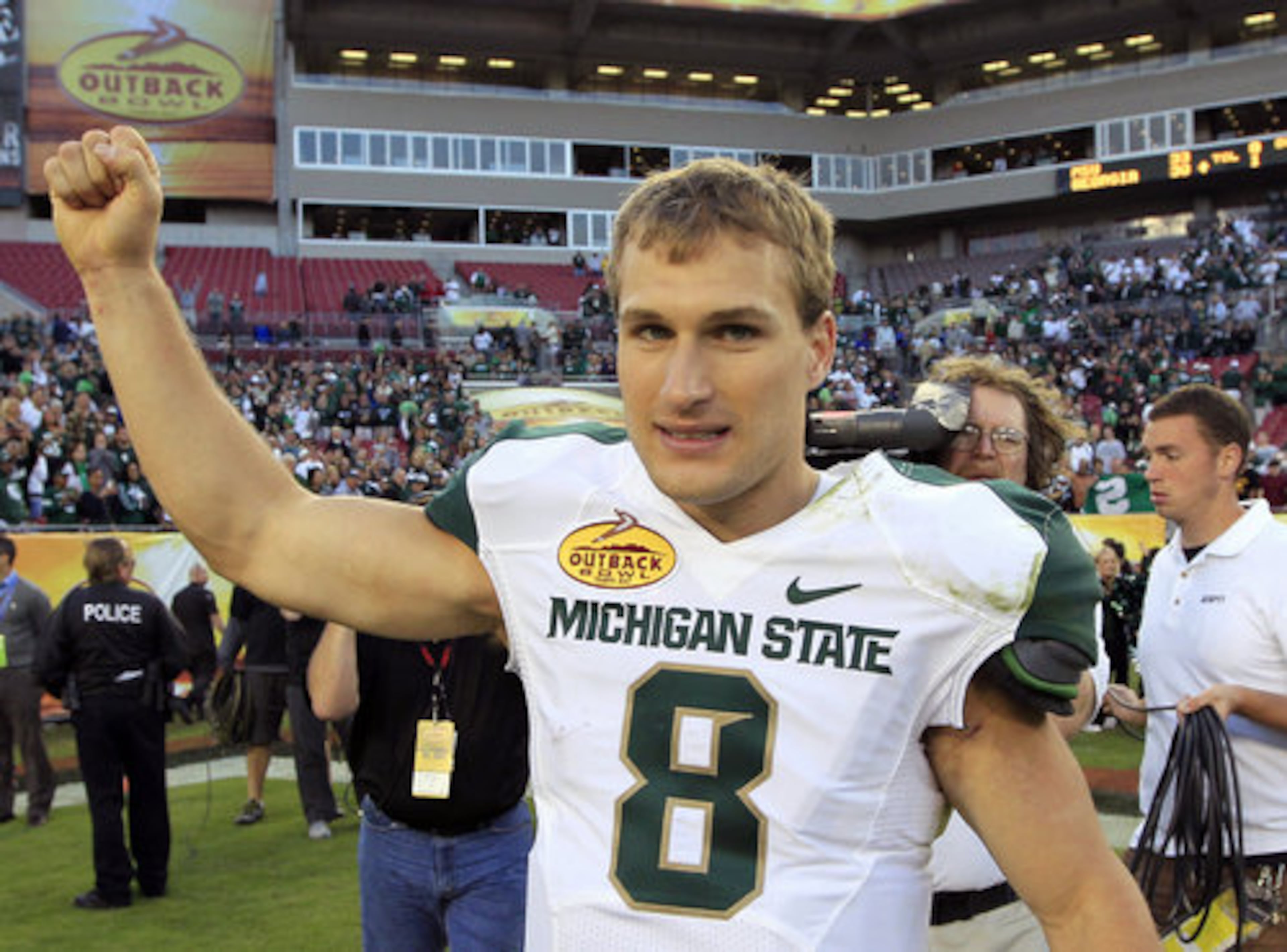 Michigan State quarterback Kirk Cousins celebrates after Michigan State's 33-30 win over Georgia.