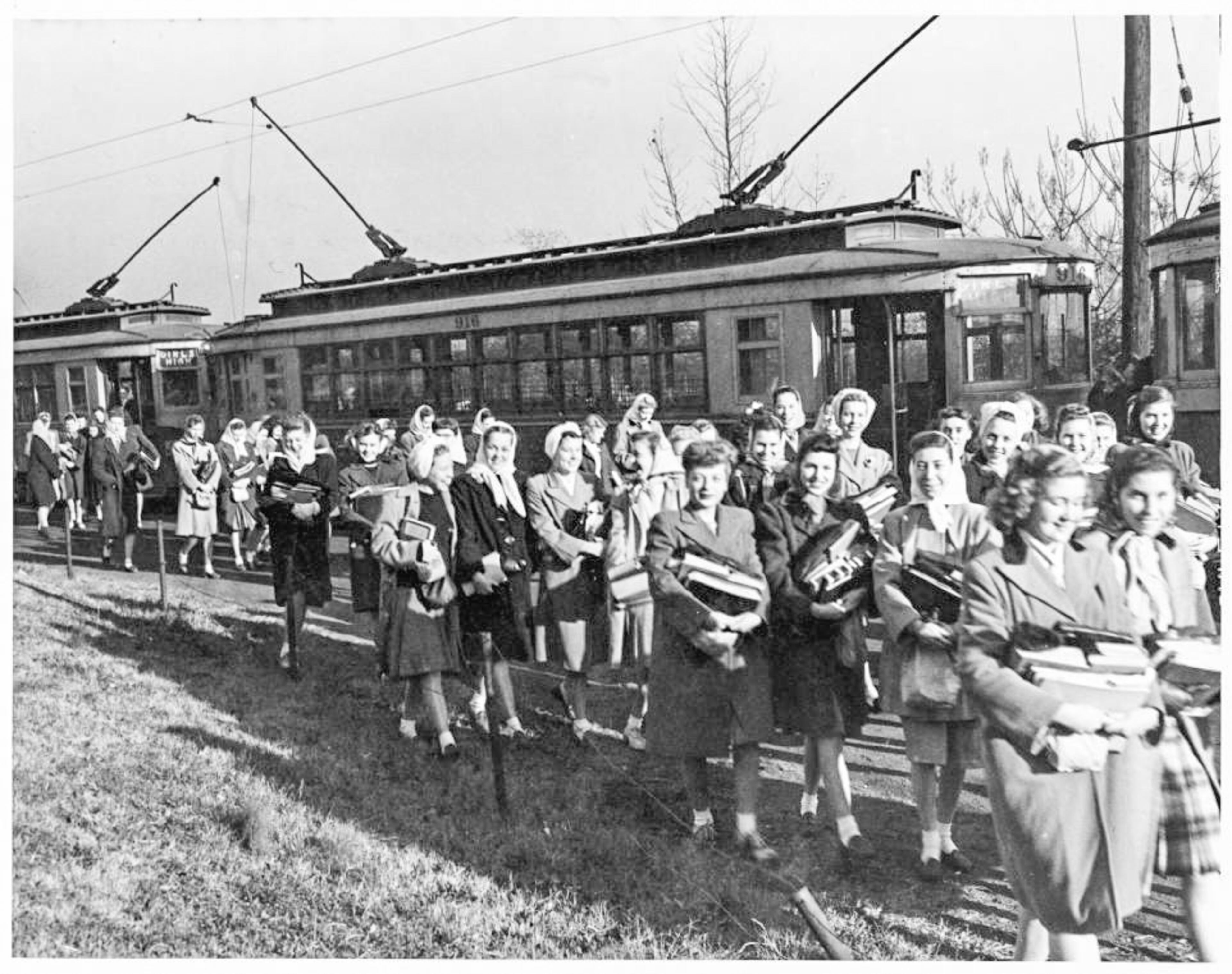 High school students getting off the trolley at the new Girls High School, Atlanta, Georgia, circa 1925.